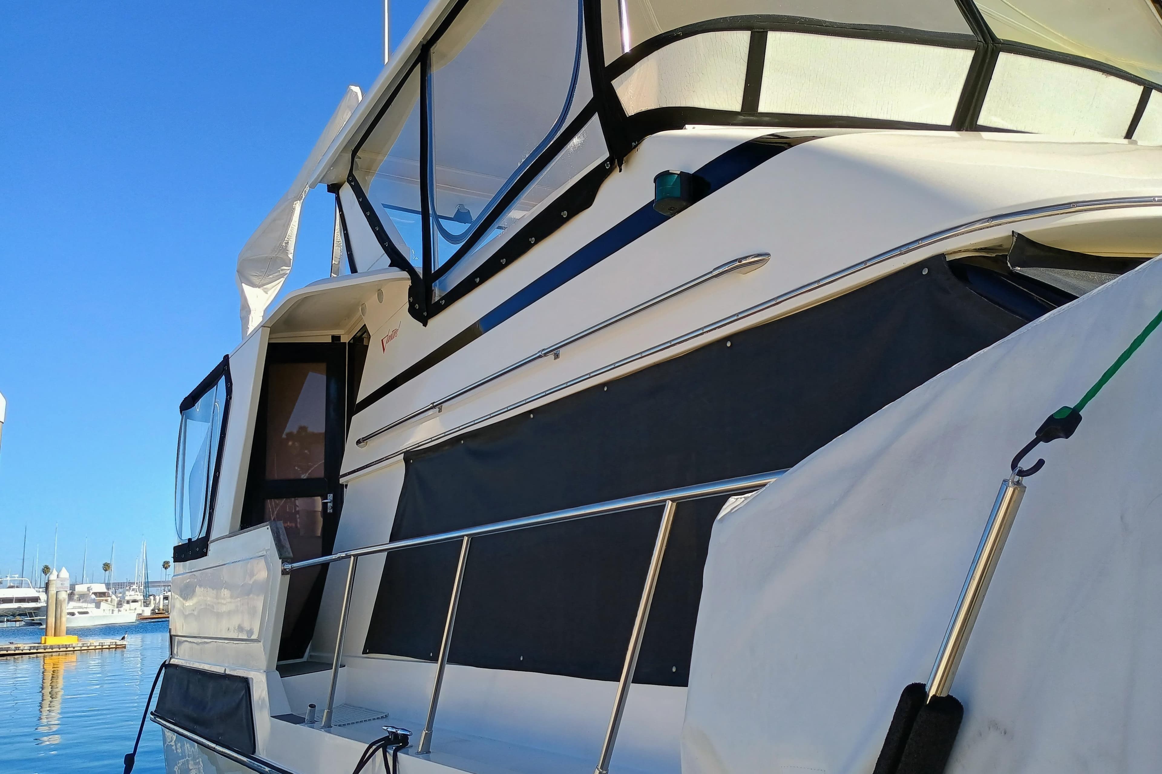 1988 Vantare 46' Aft Cabin Wide Body MY yacht docked under clear blue sky.