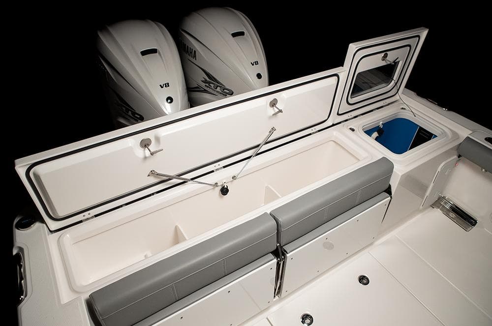 Manufacturer Provided Image: 2025 Everglades 335 Center Console boat interior with storage and dual Yamaha V8 engines.