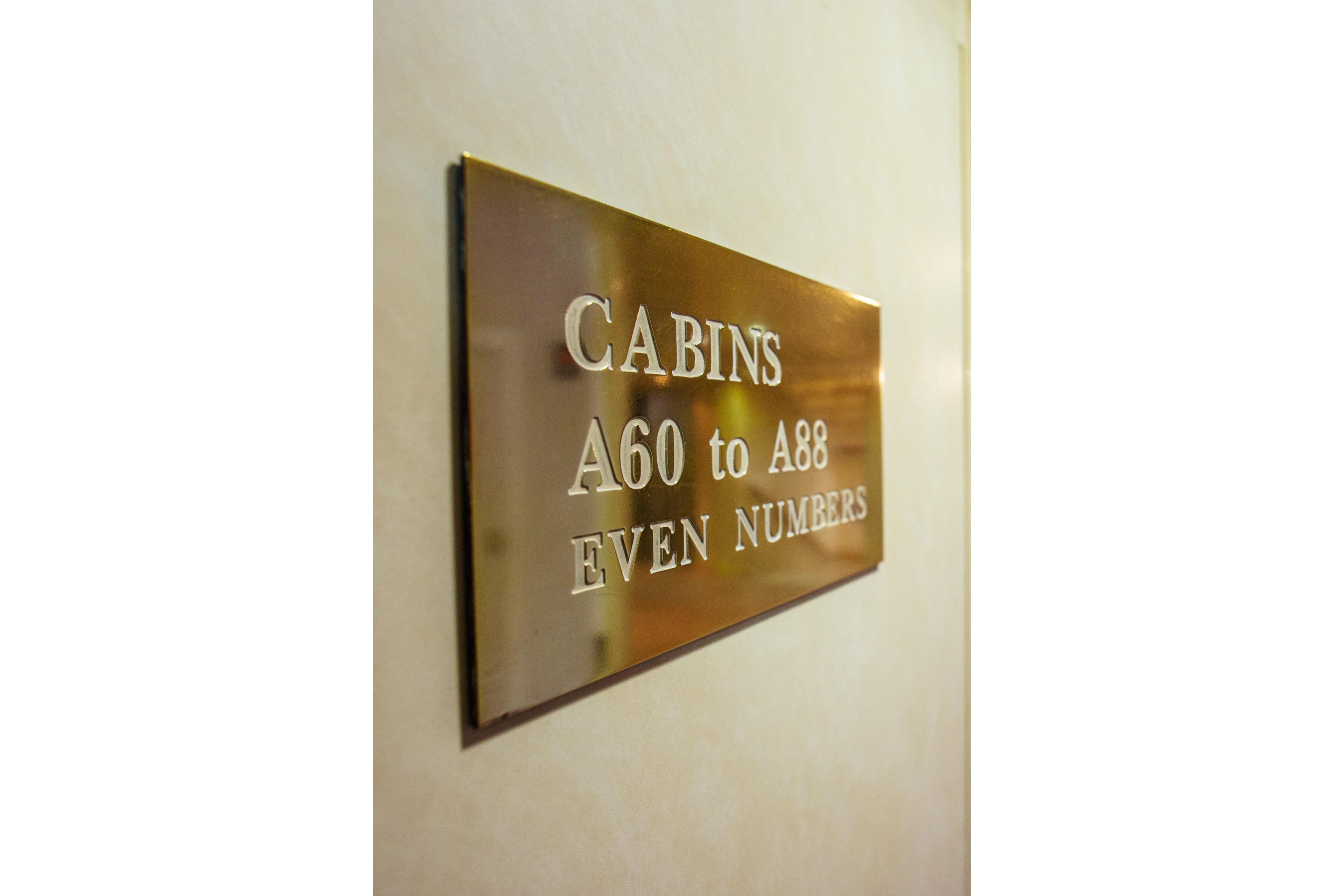 Sign on cruise ship Minerva indicating cabins A60 to A88, even numbers.