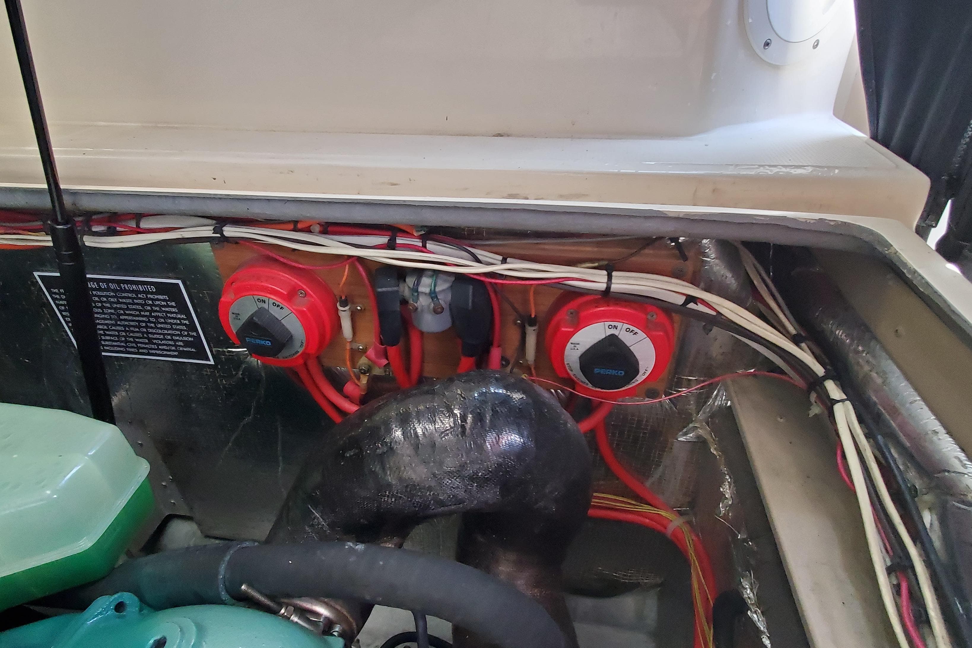 1998 Albemarle 280 Express Fisherman engine compartment with wiring and battery switches.