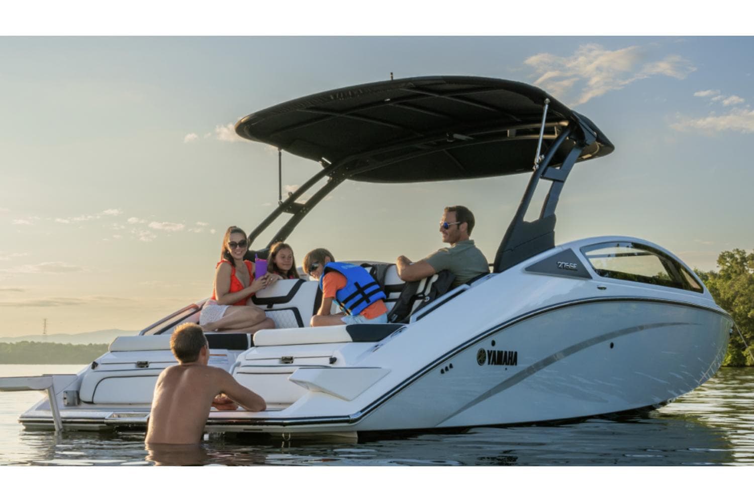 Manufacturer Provided Image: 2025 Yamaha Boats 275SE on water with people enjoying a sunny day.