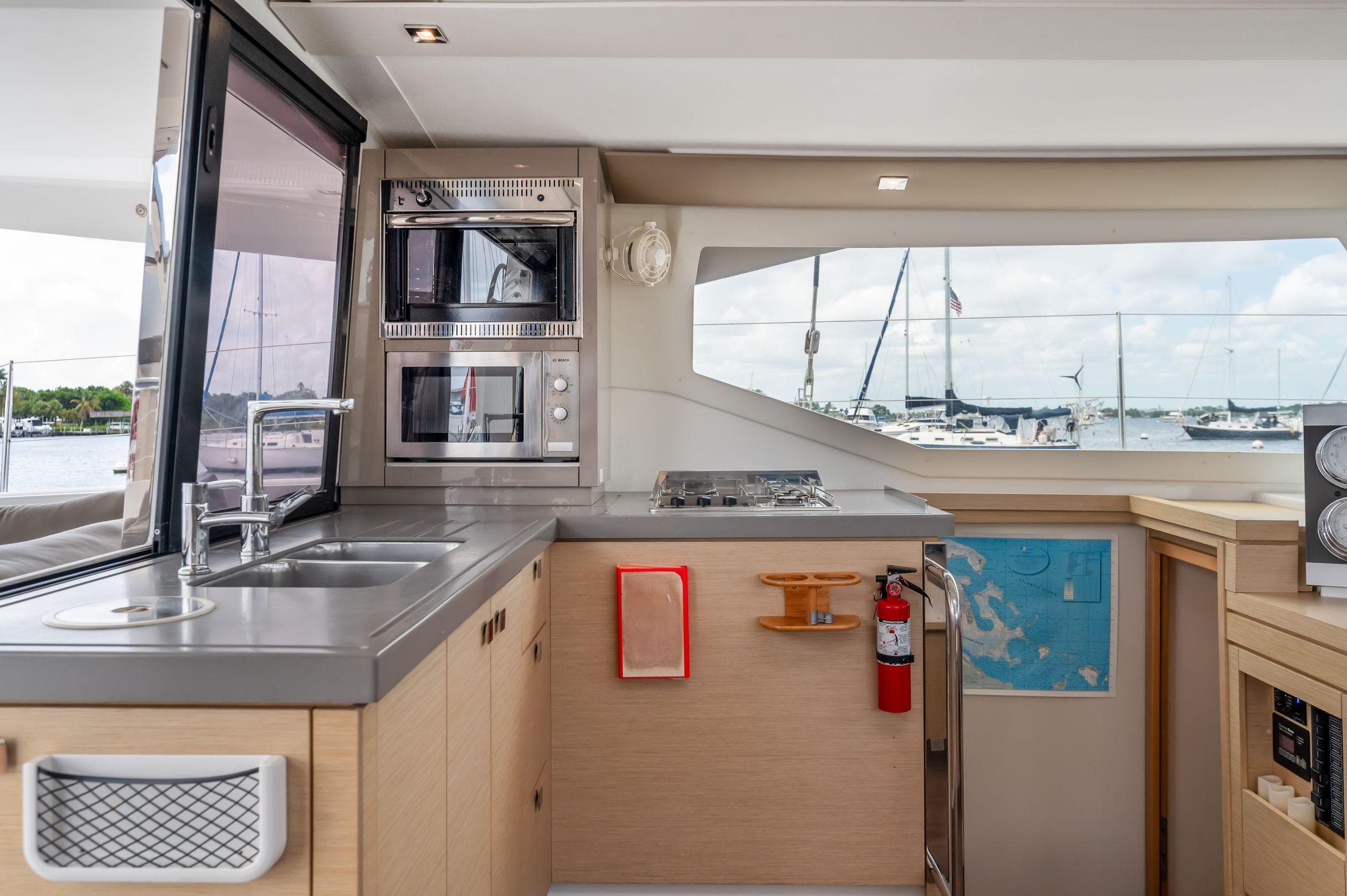 Modern kitchen interior of 2018 Fountaine Pajot Lucia 40 catamaran with ocean view.