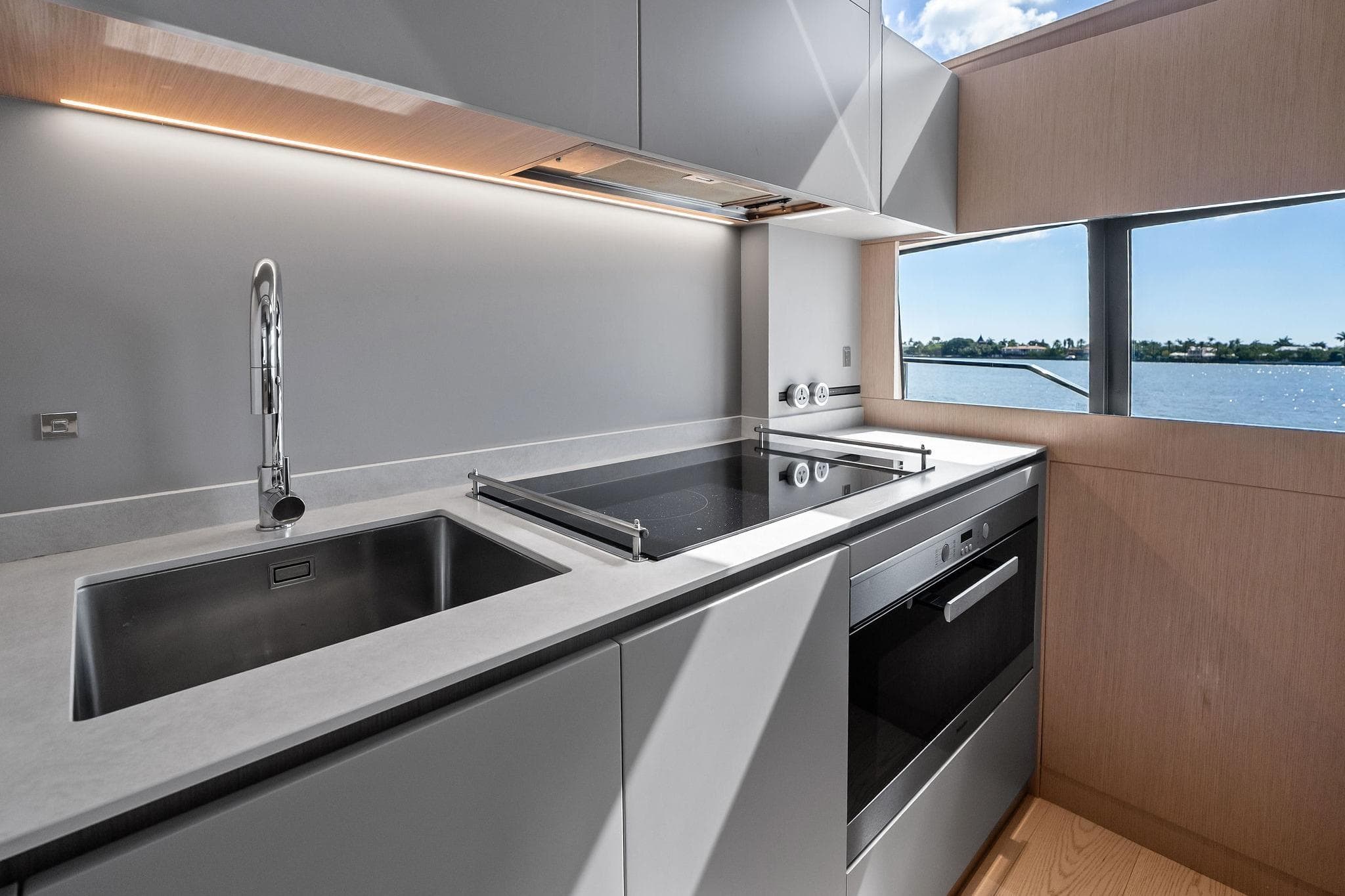 Modern kitchen interior on 2022 Ferretti Yachts 780, featuring sleek design and ocean view.