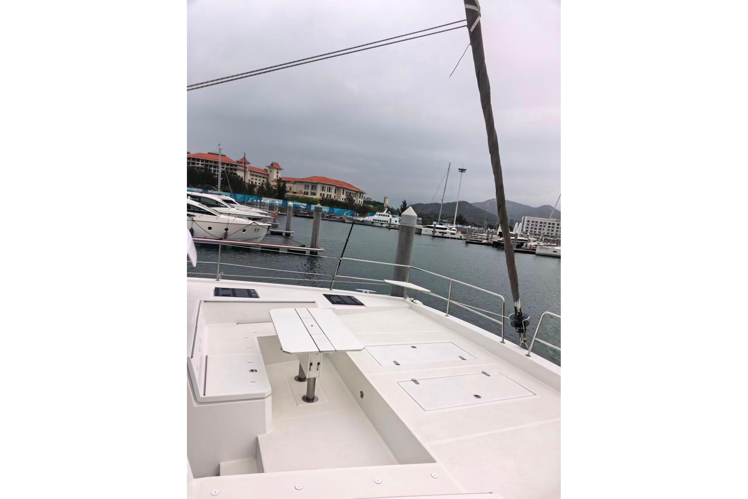 2022 Bali 4.6 yacht docked at marina with overcast sky.