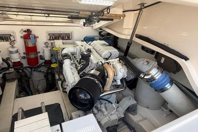 Engine room of a 2010 Tiara Yachts 3900 Open, showcasing mechanical components.