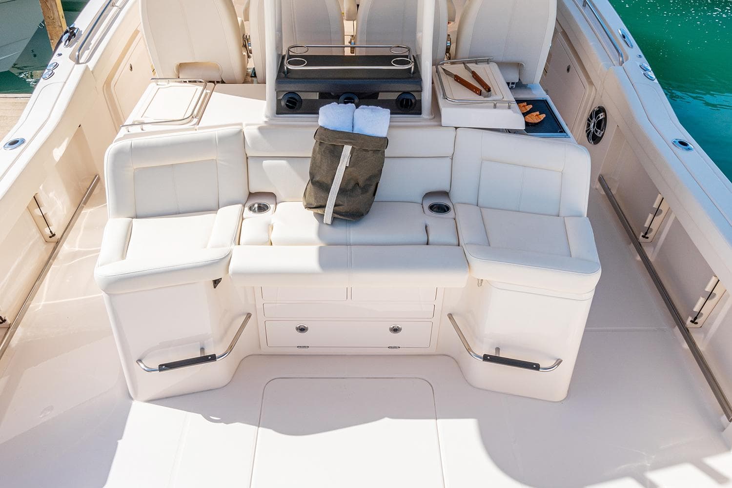 Manufacturer Provided Image: 2023 Grady-White Canyon 456 boat interior with white seating and storage compartments.