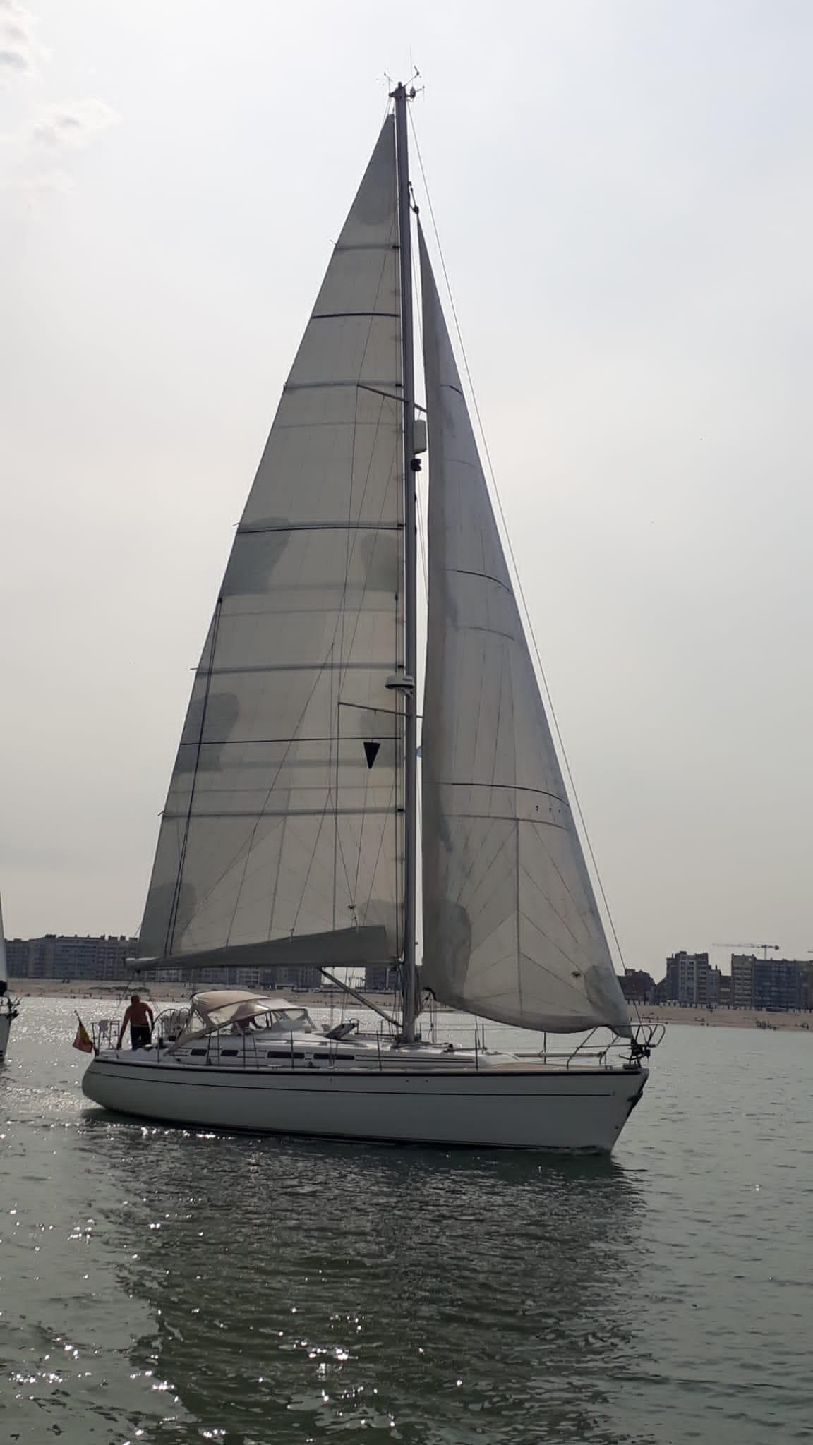Sailing yacht Dehler 41 CR 1997 on calm waters under overcast sky.