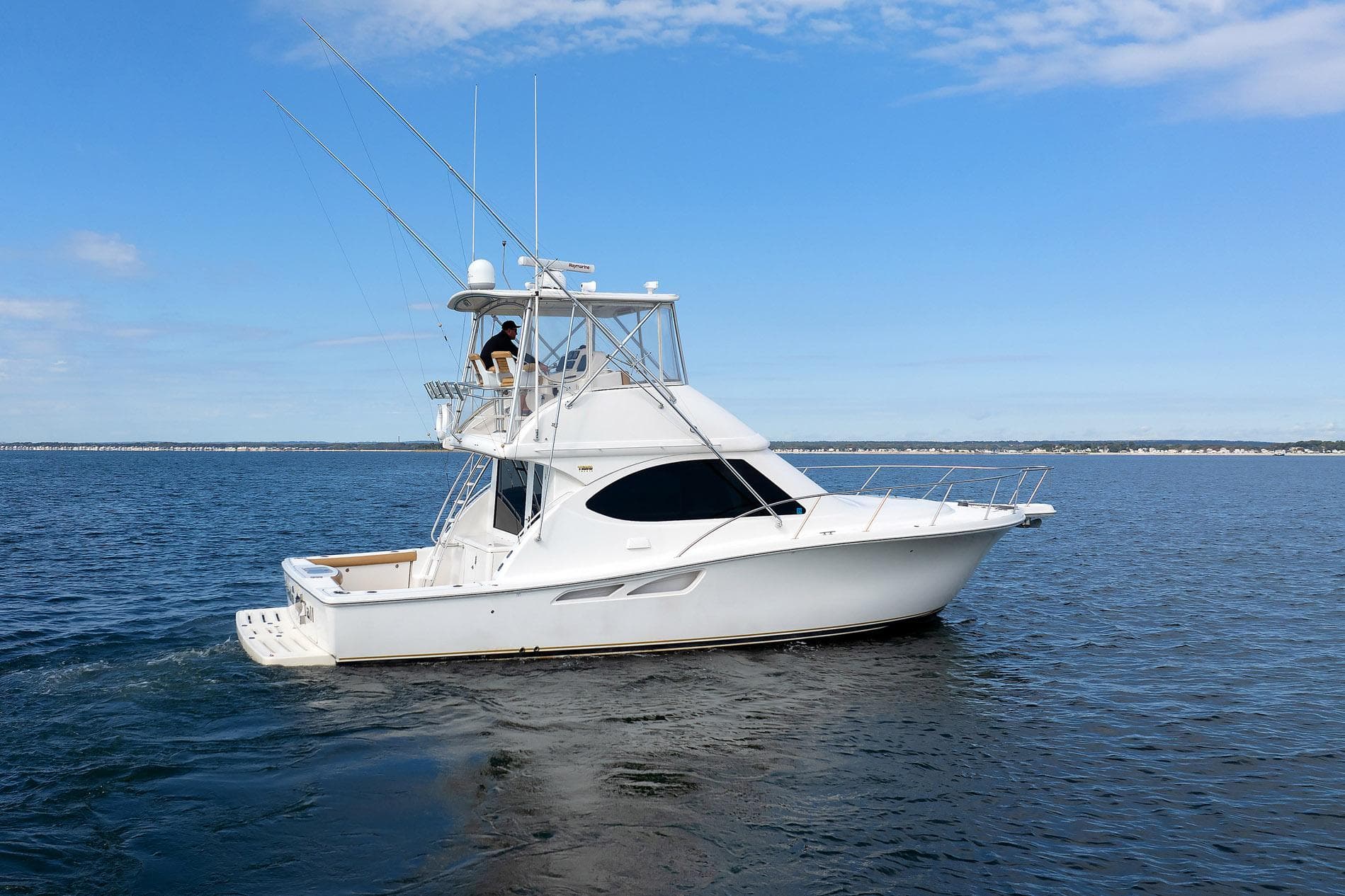 2007 Tiara Yachts 3900 Convertible cruising on open water under blue sky.