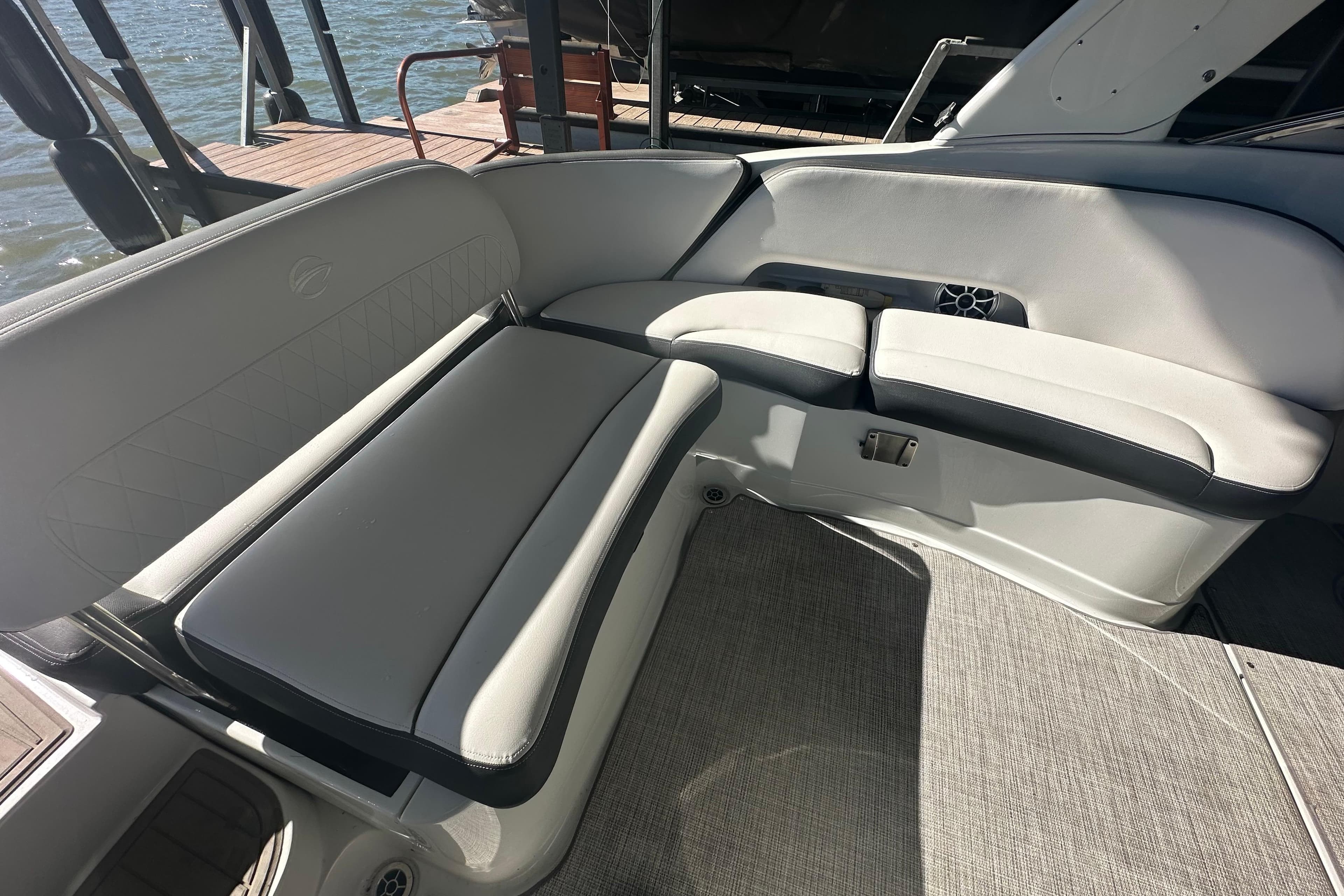 2023 Crownline 290 CR boat interior with gray seating and waterfront view.