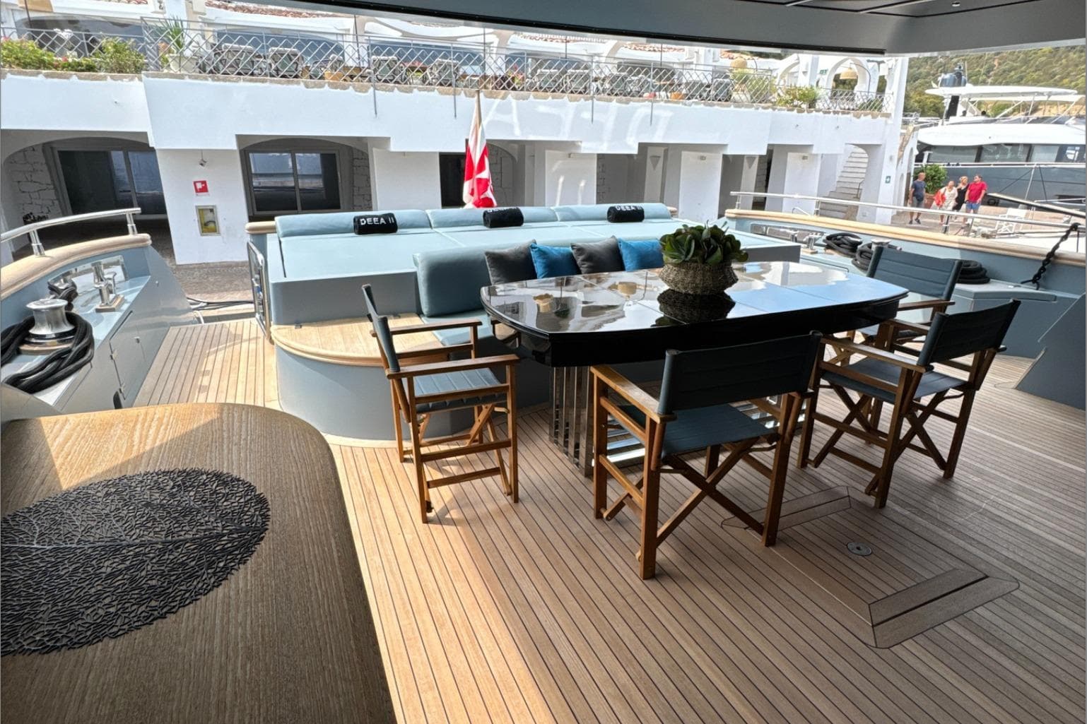 Luxurious deck of 2009 Cerri Cantieri Navali 102 yacht with elegant seating and table.