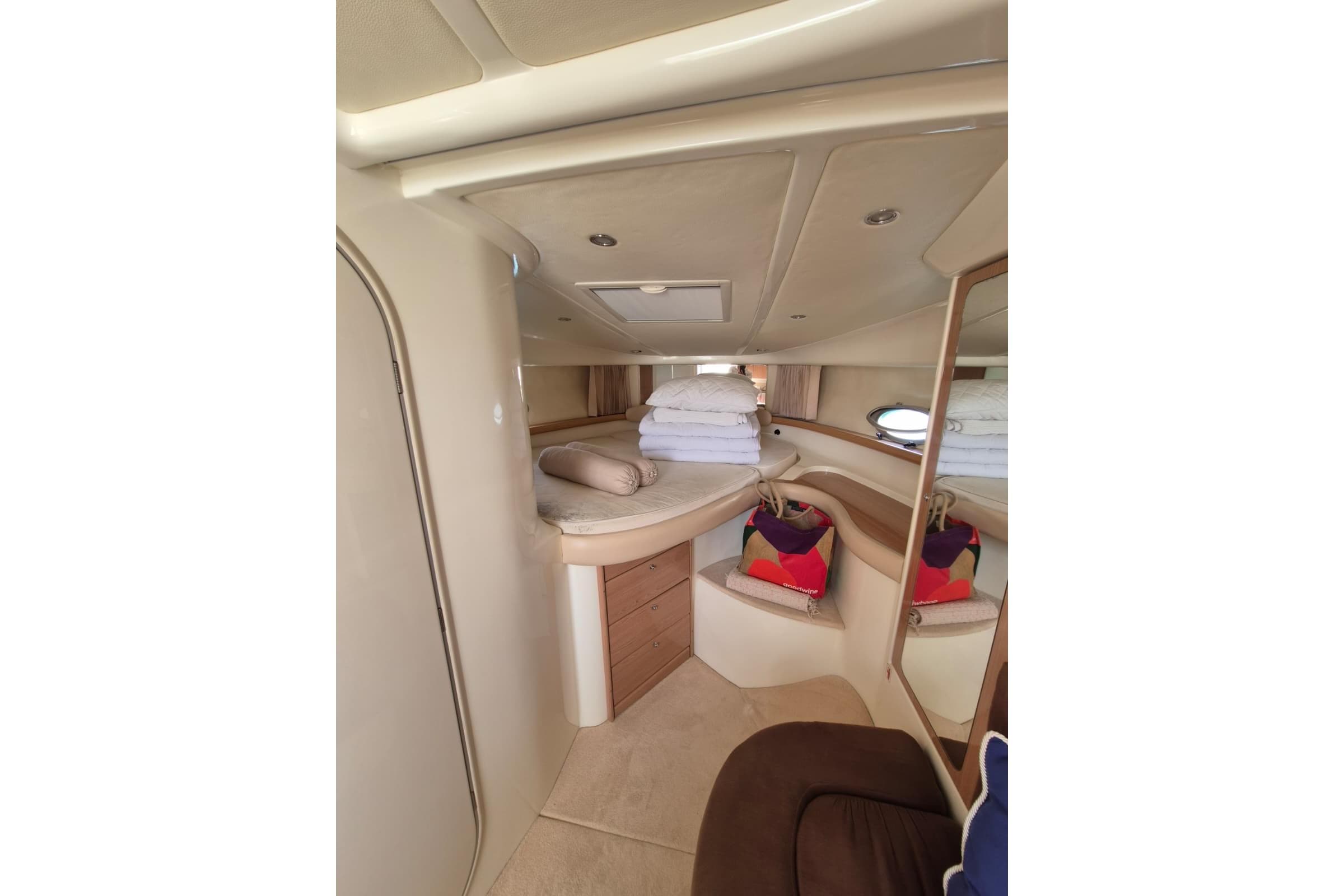 Interior of 2008 Atlantis 345sc yacht cabin with cozy bedding and storage.