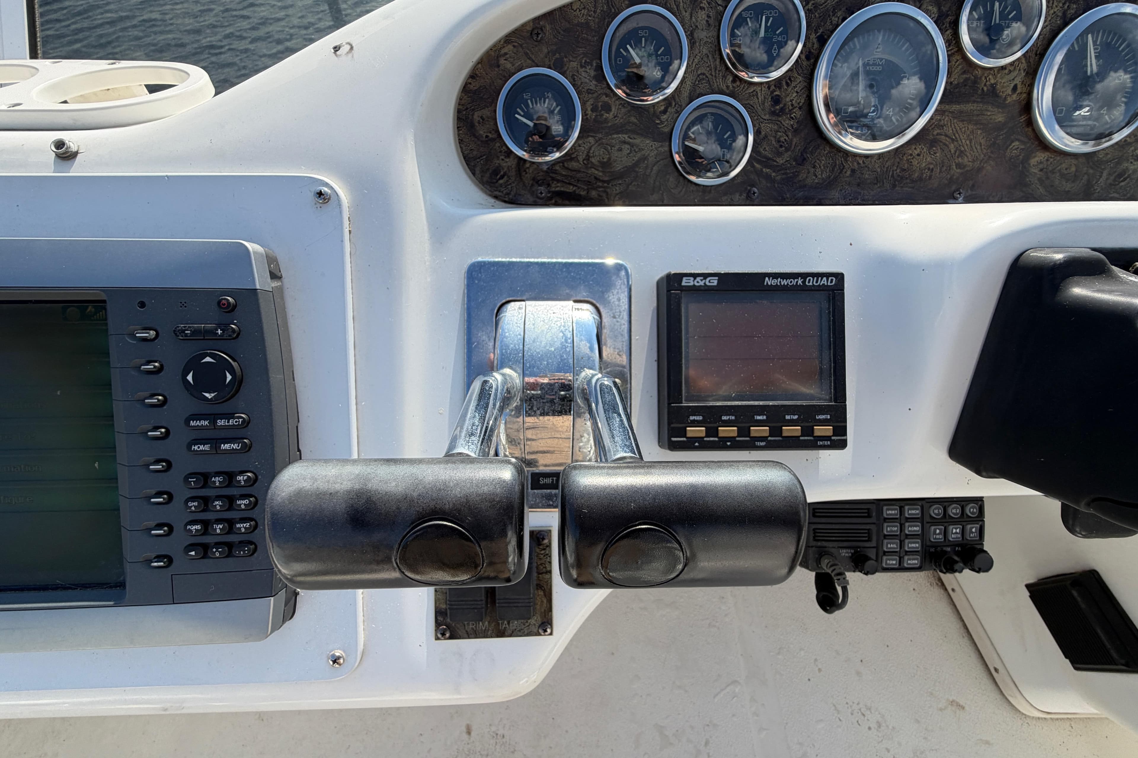 1997 Sea Ray 370 Aft Cabin helm with gauges and navigation controls.