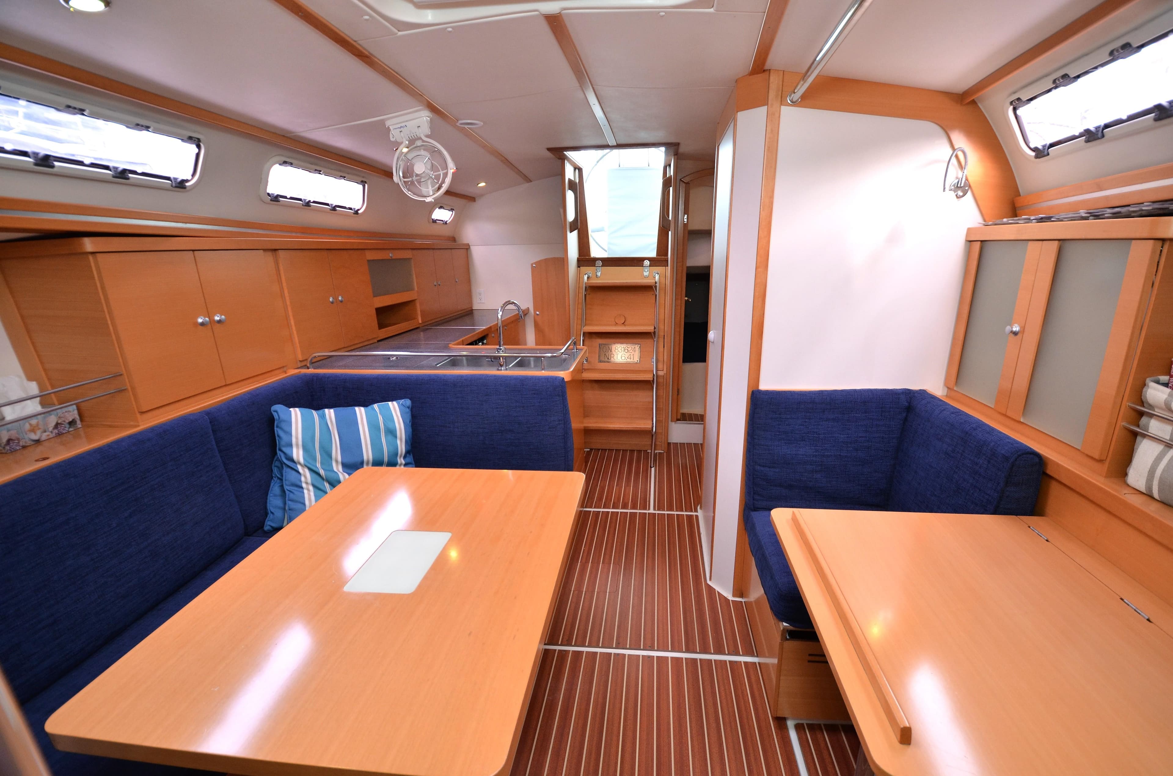 Interior of a 2007 Hanse 370e yacht with wooden furnishings.