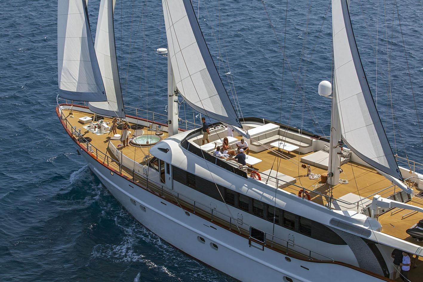 Luxurious 2012 Custom Sail 38 m yacht with spacious deck and elegant sails on open sea.