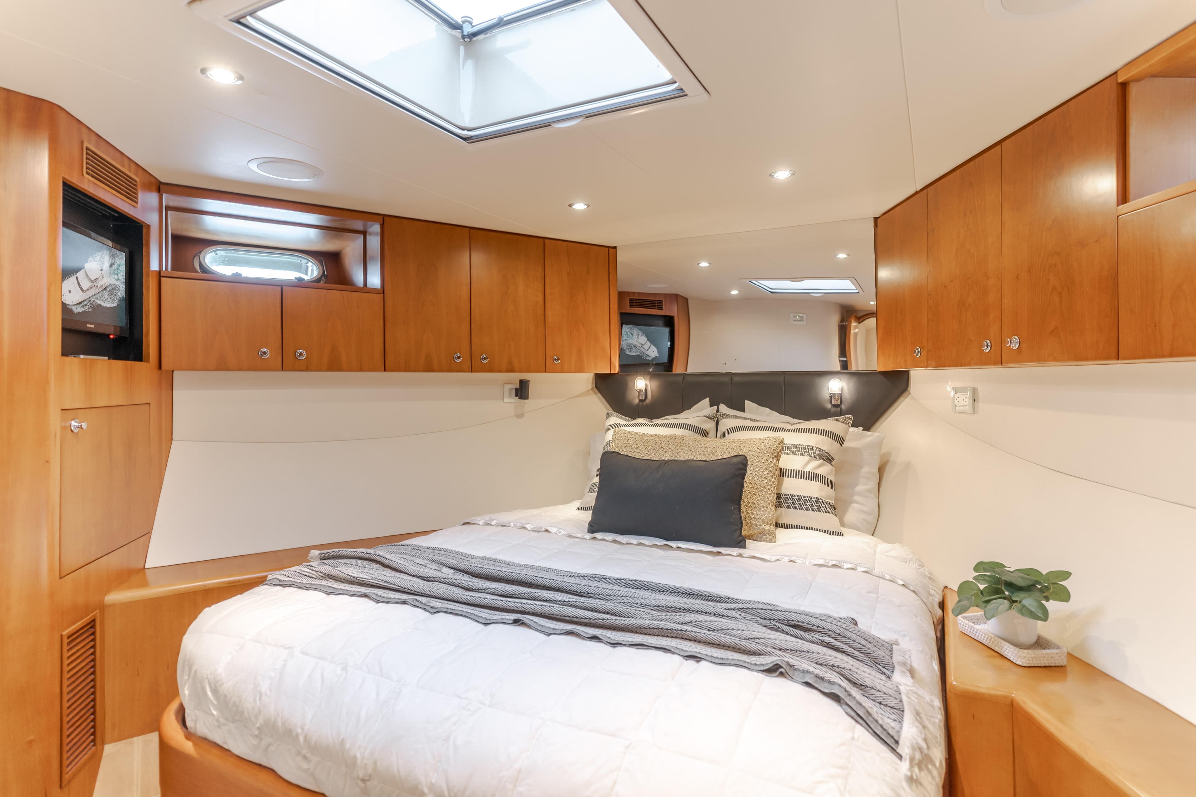 Luxurious bedroom interior of 2006 Cheoy Lee 72' Raised Pilot House yacht.