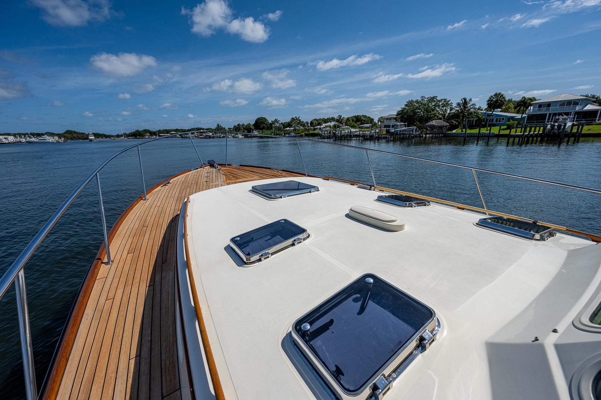 2008 Hinckley Talaria 44 FB yacht deck with scenic waterfront view.