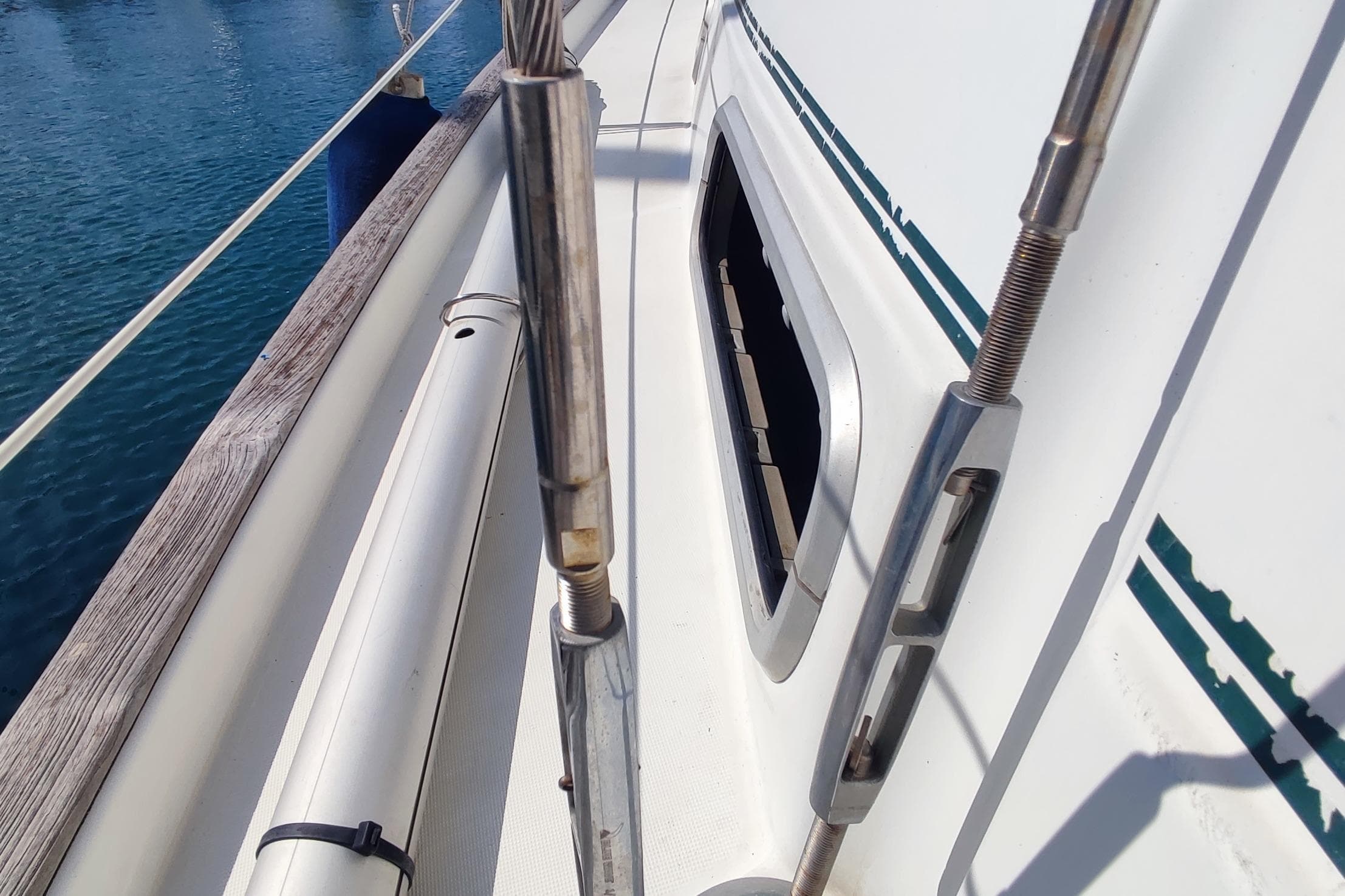 Deck view of 1997 Beneteau Oceanis 36 CC sailboat with railing and window.