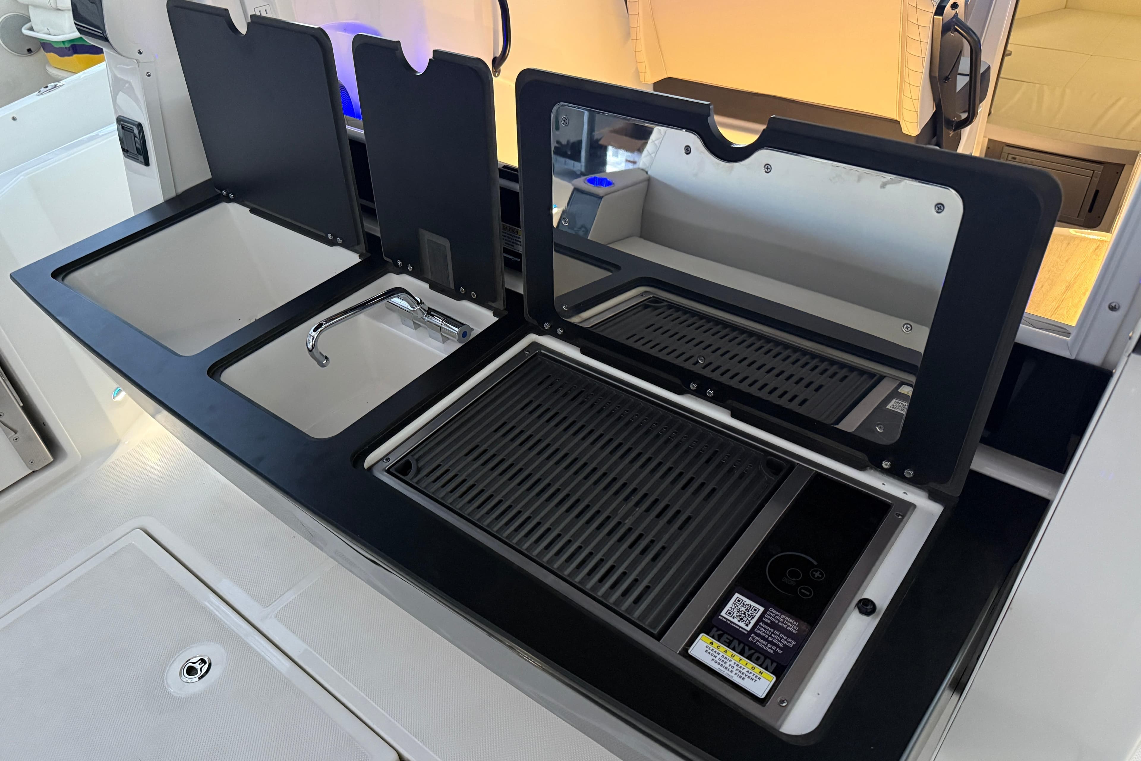 2025 Navan C30 kitchen area with sink, faucet, and grill setup.