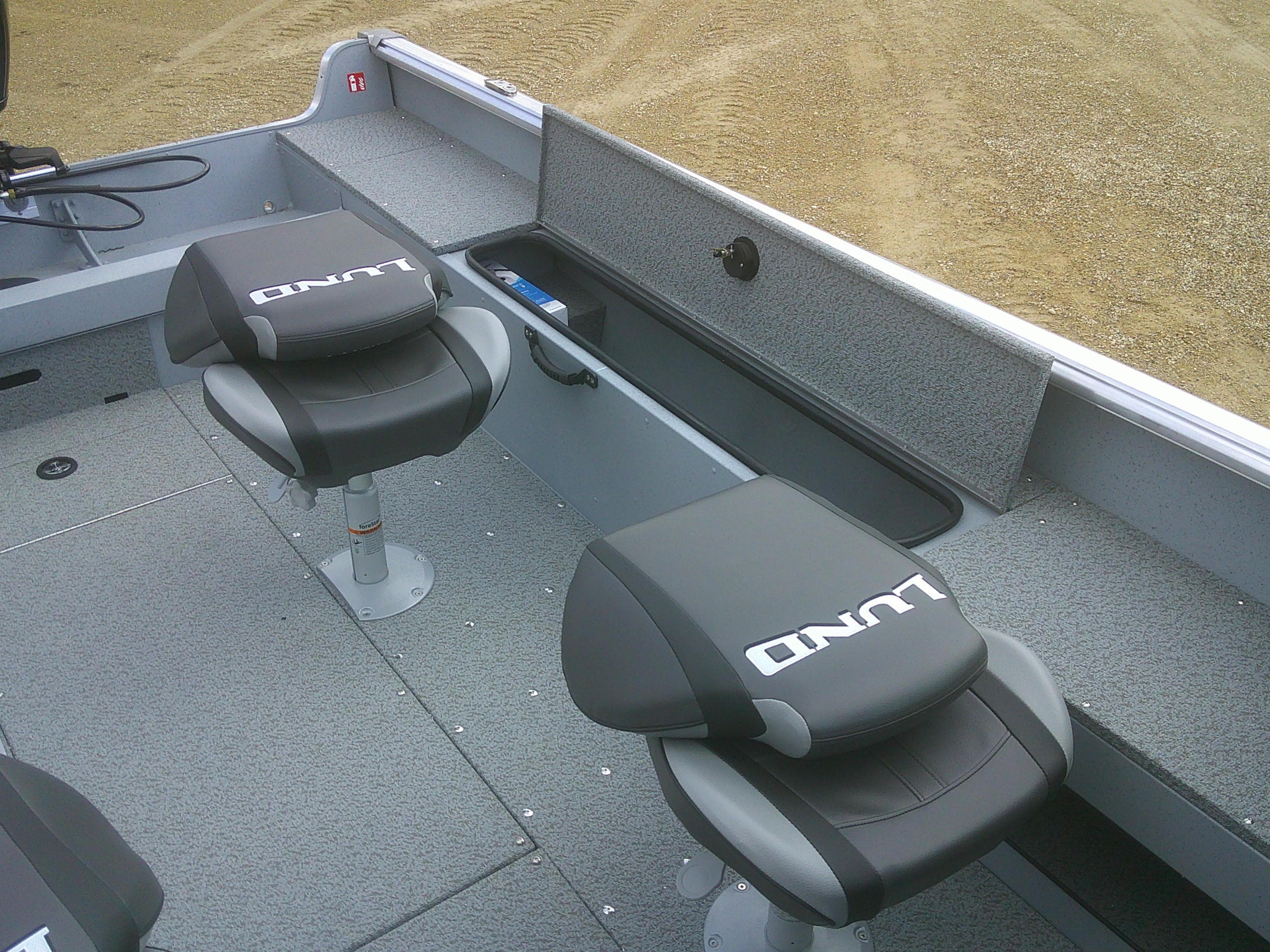 2025 Lund 2075 Alaskan Sport boat interior with two cushioned seats.