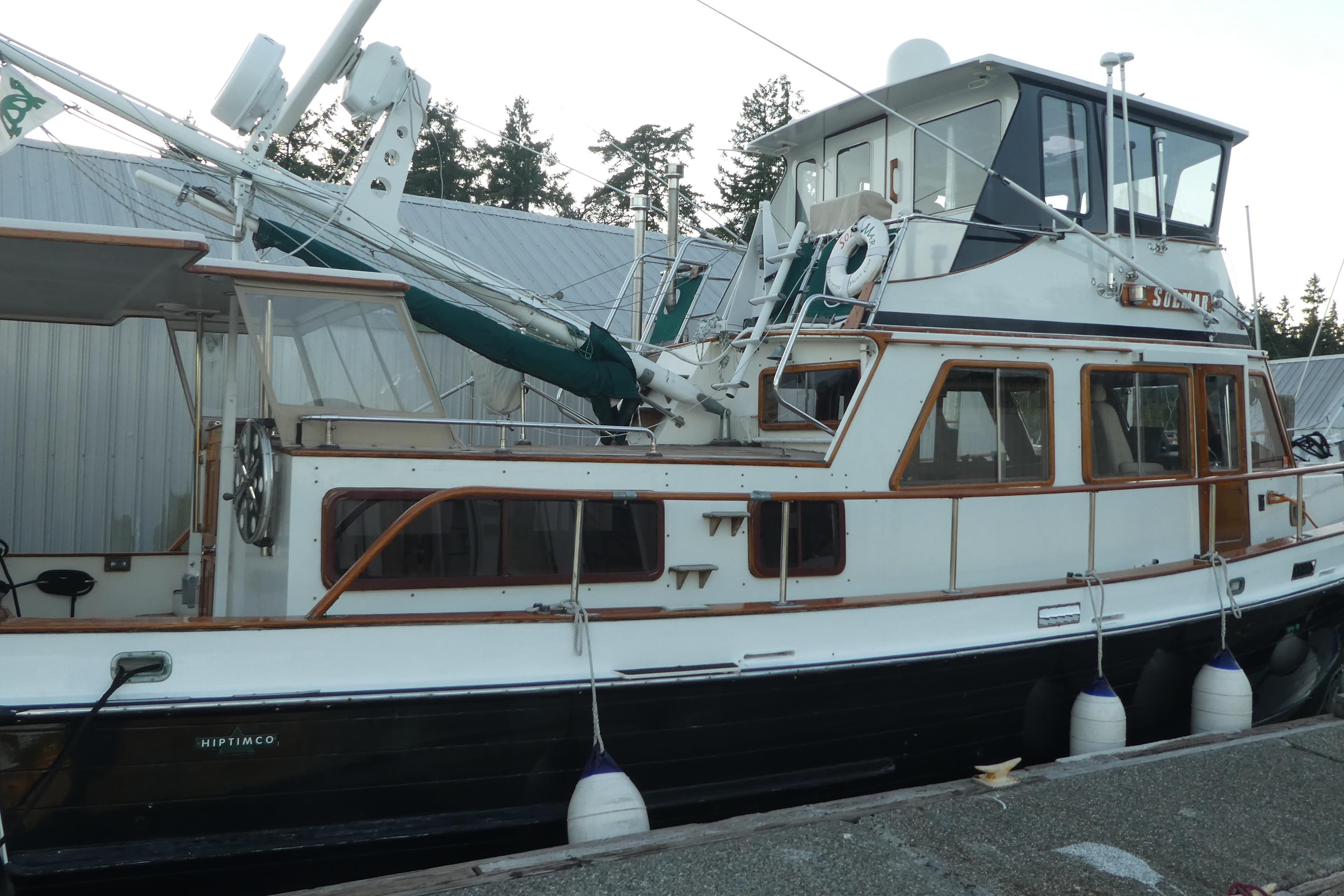 1979 Hiptimco 40' Trawler docked, featuring classic design and wooden accents.