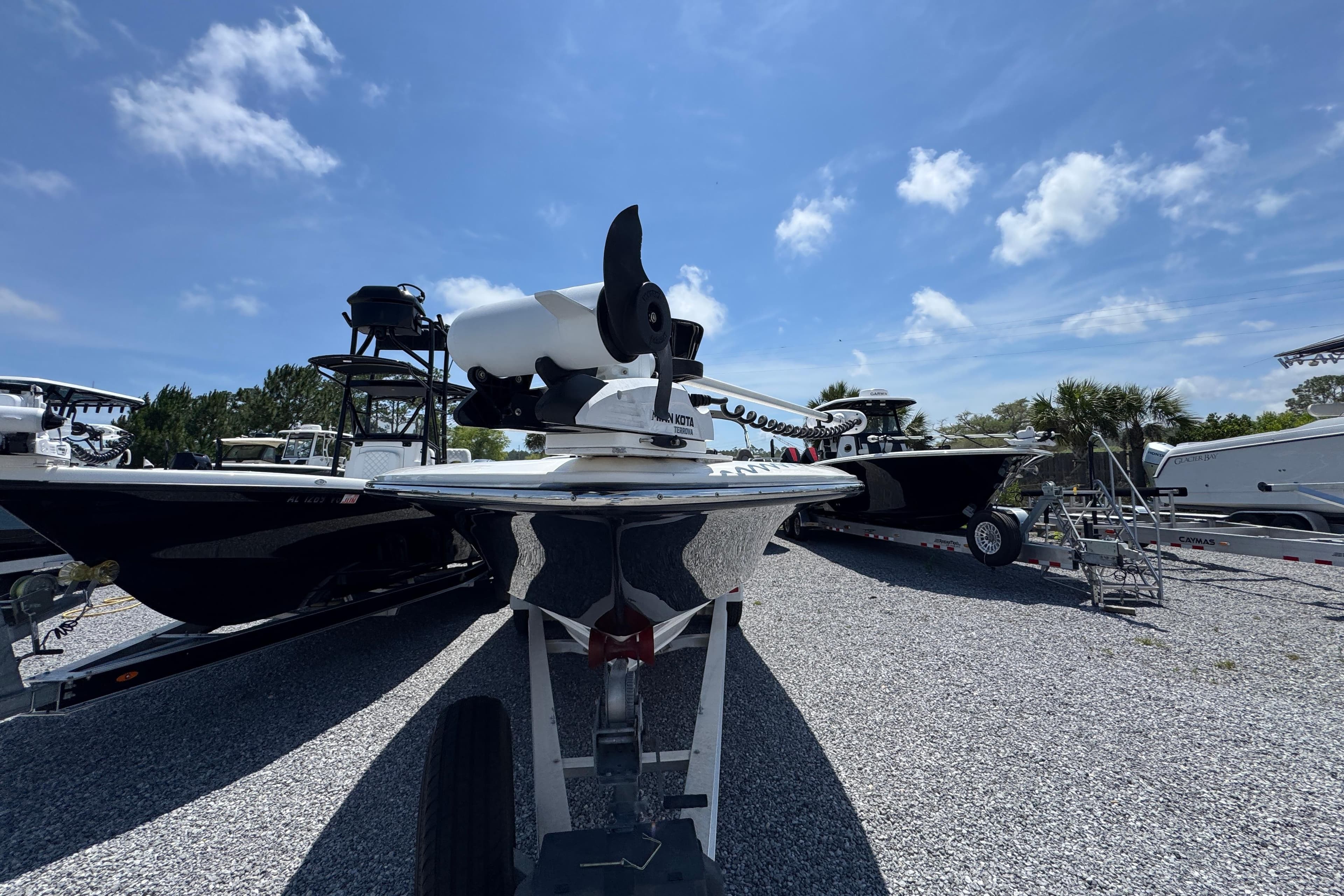 2019 ShearWater 270 Carolina Flare boat on trailer under clear blue sky.