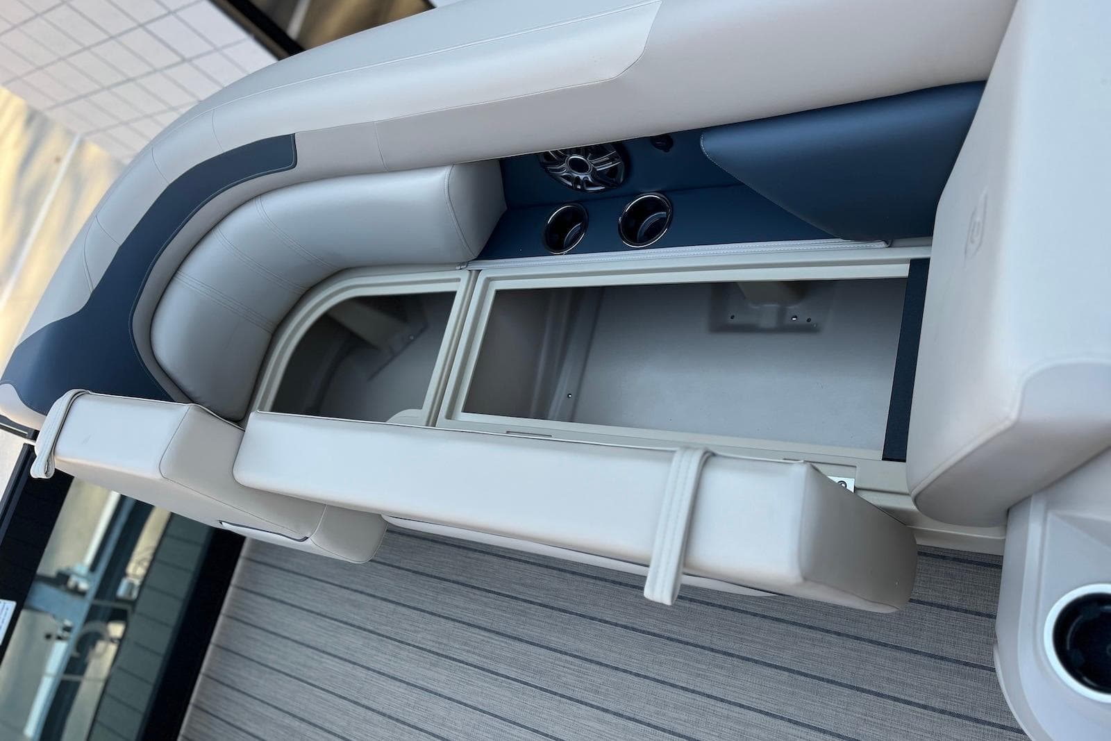 2026 Godfrey SWEETWATER 2286 SFL boat interior with storage compartment and seating.