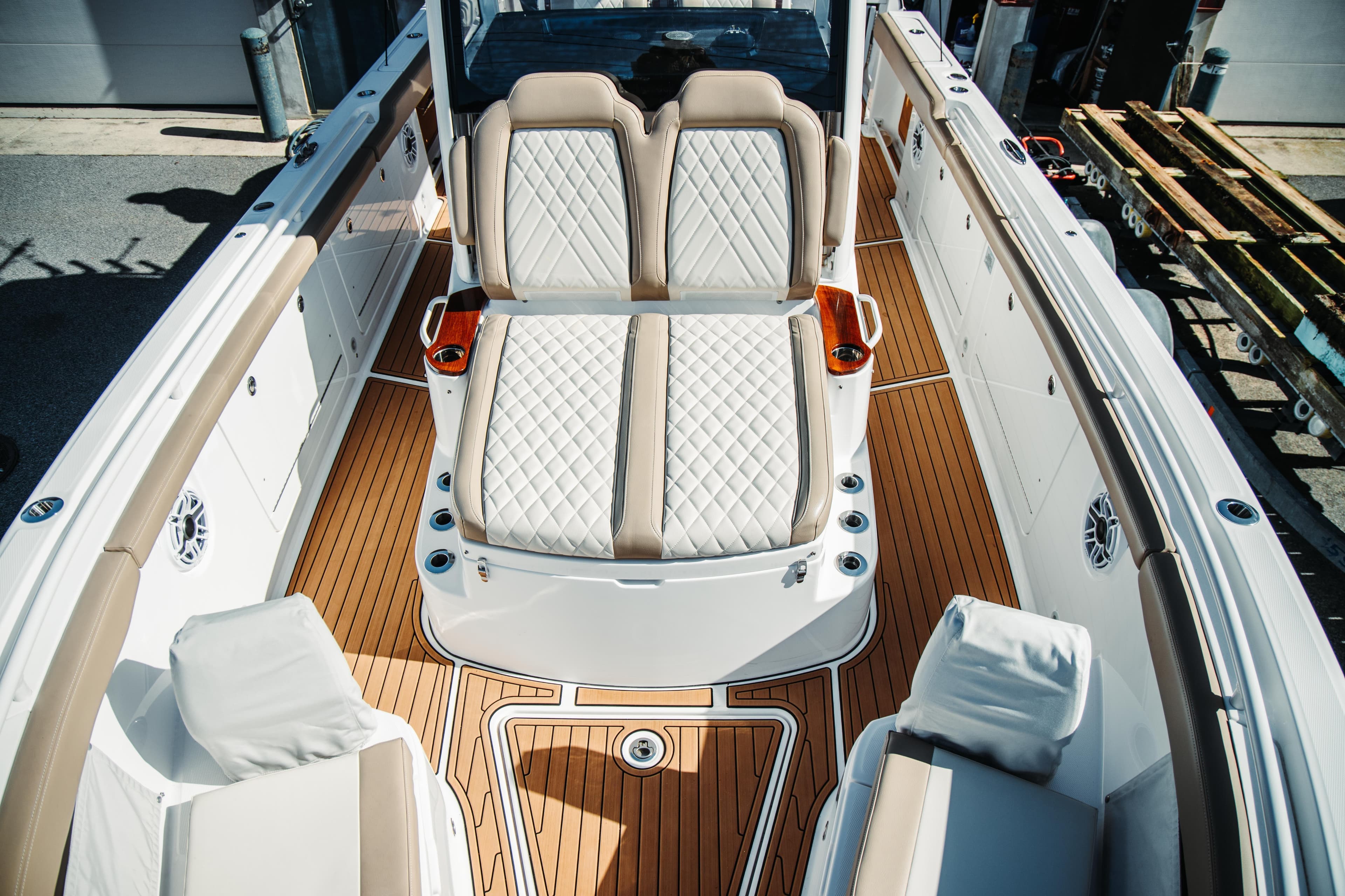 2024 Everglades 315 Center Console boat with luxurious seating and teak flooring.