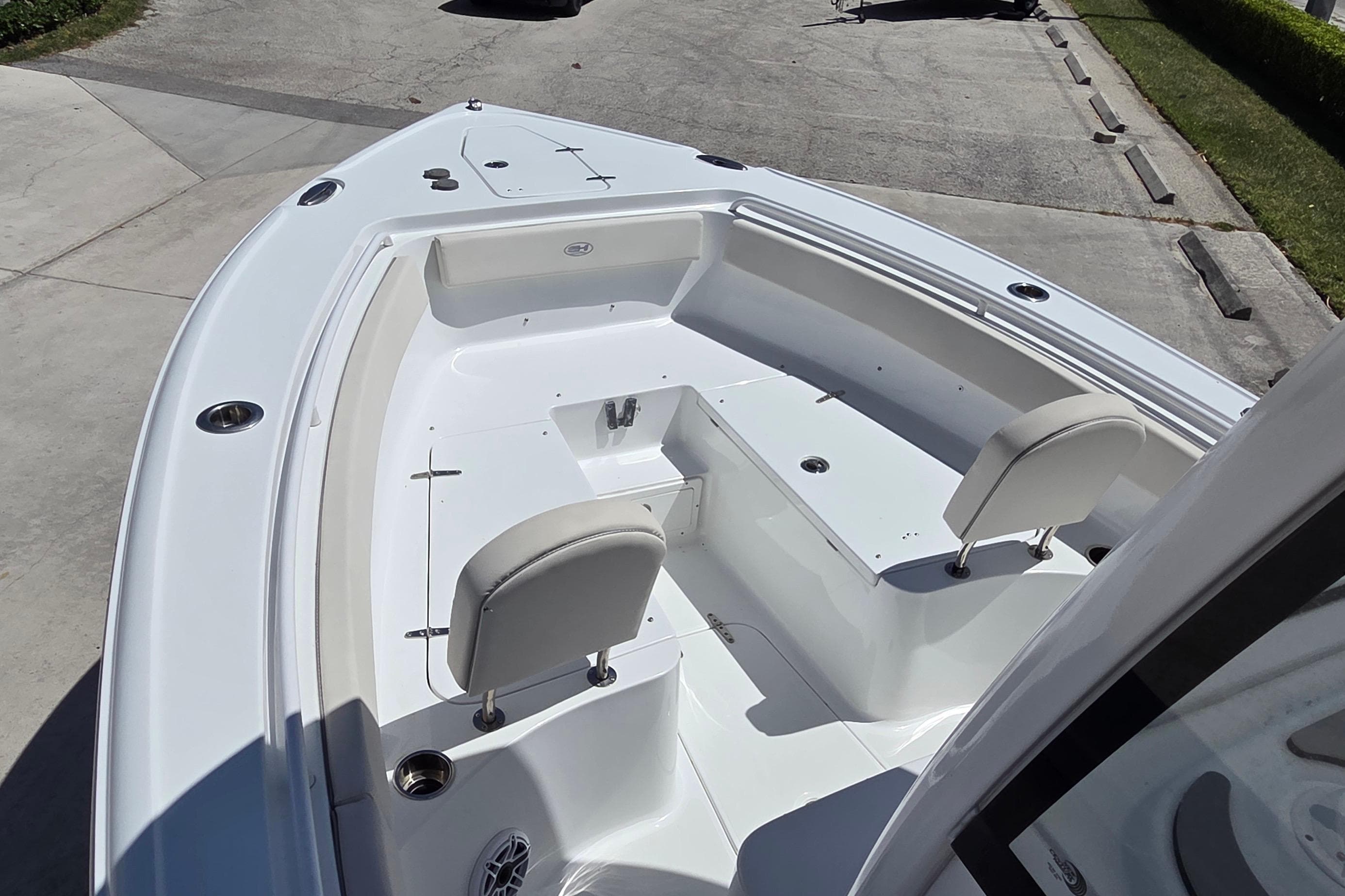 2025 Sea Hunt Ultra 265 SE boat interior with seating and storage compartments.
