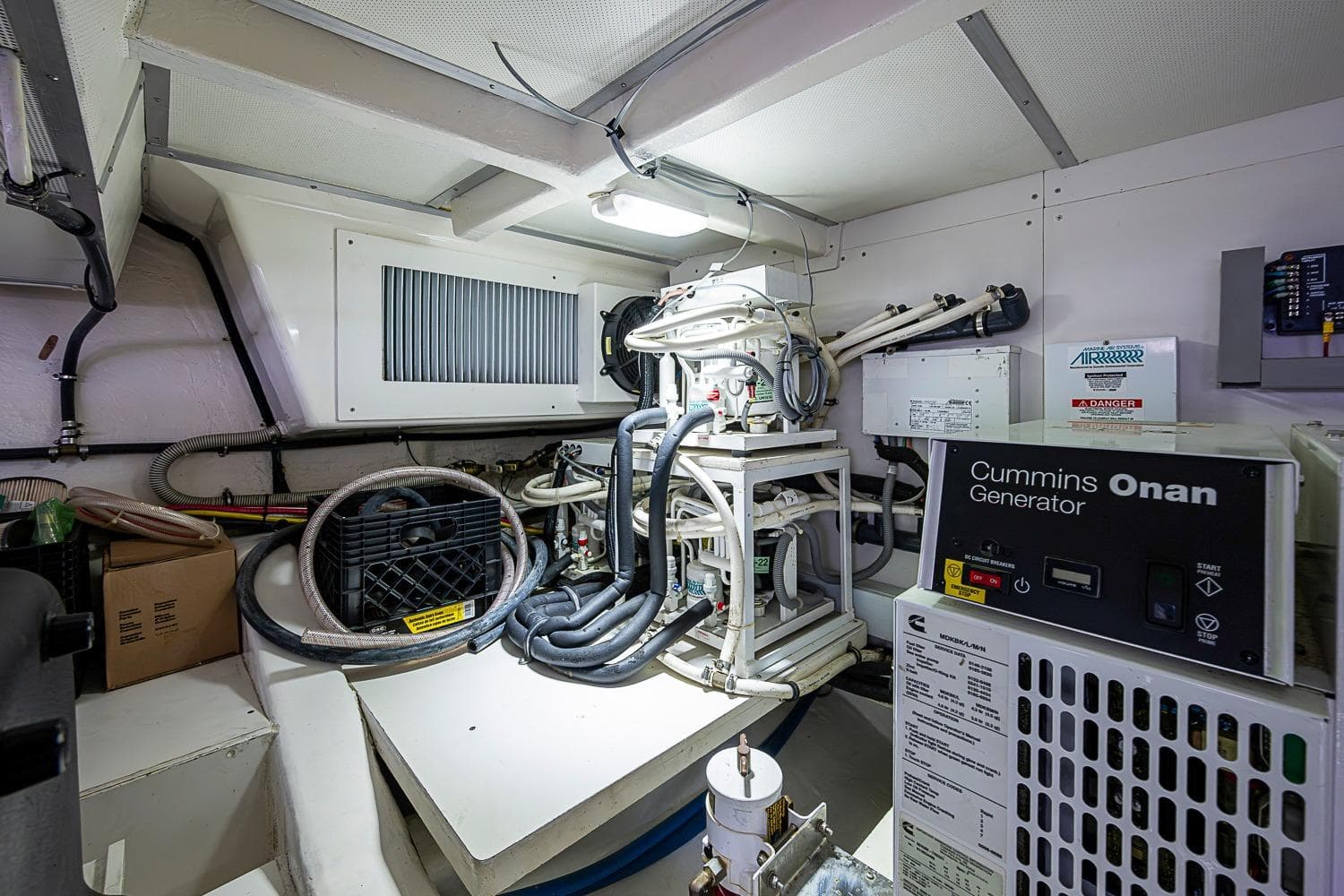 Engine room of 2014 Grand Banks 46 Eastbay SX with Cummins Onan generator.