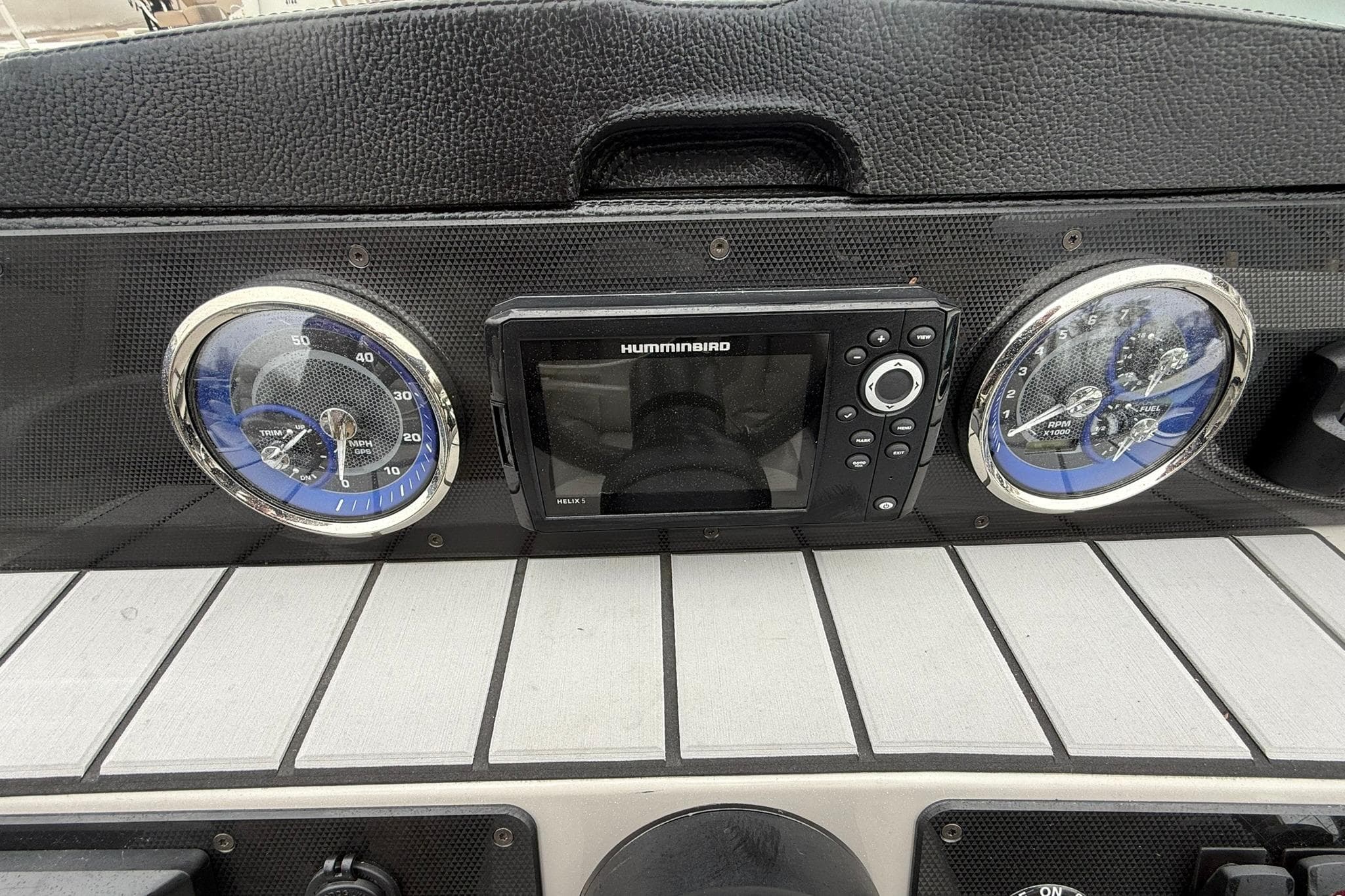 Dashboard of 2026 Premier 210 Sunsation RL Tritoon with gauges and Humminbird display.