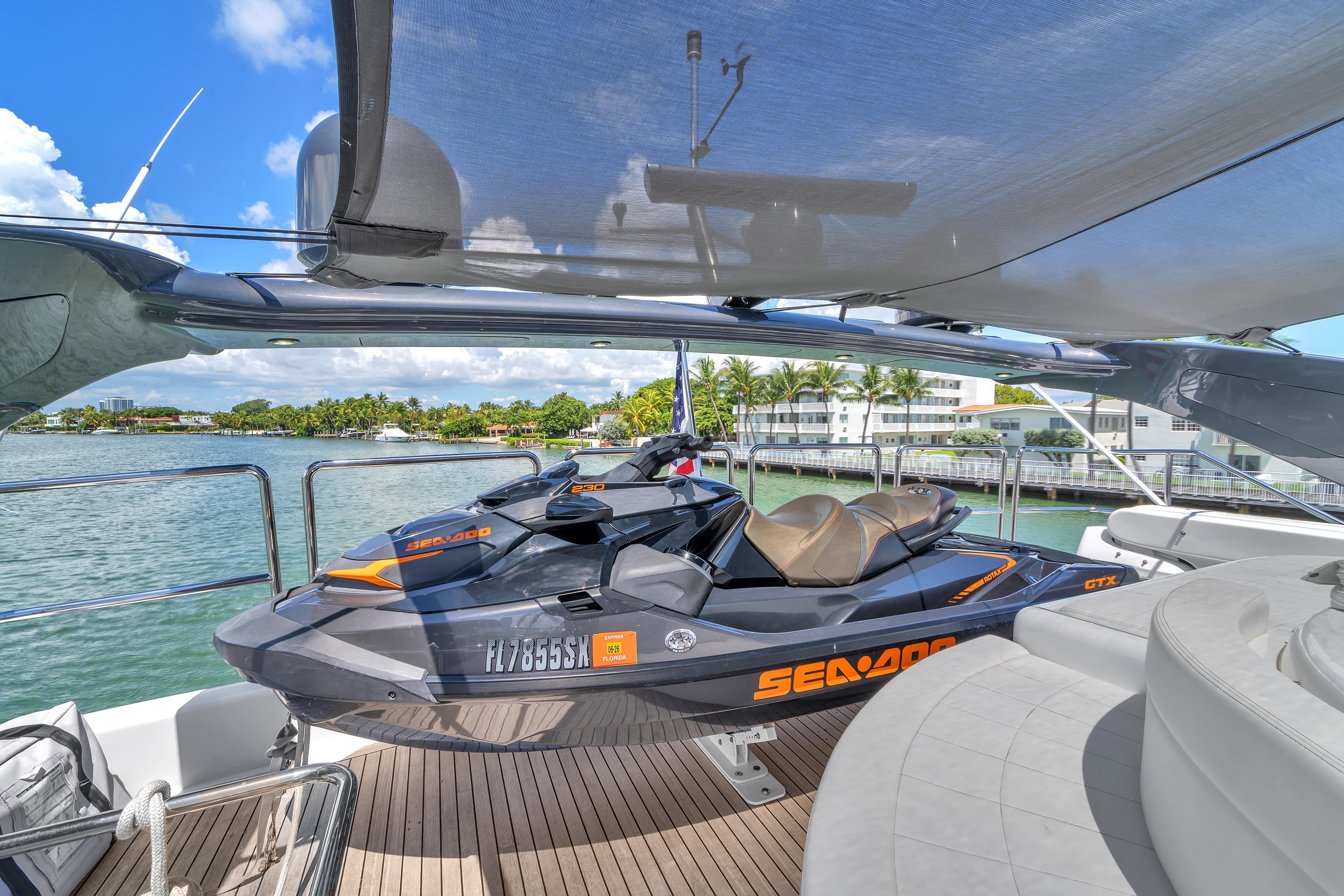 Luxury yacht deck with jet ski, Ferretti Yachts Custom Line 94, 2002 model.