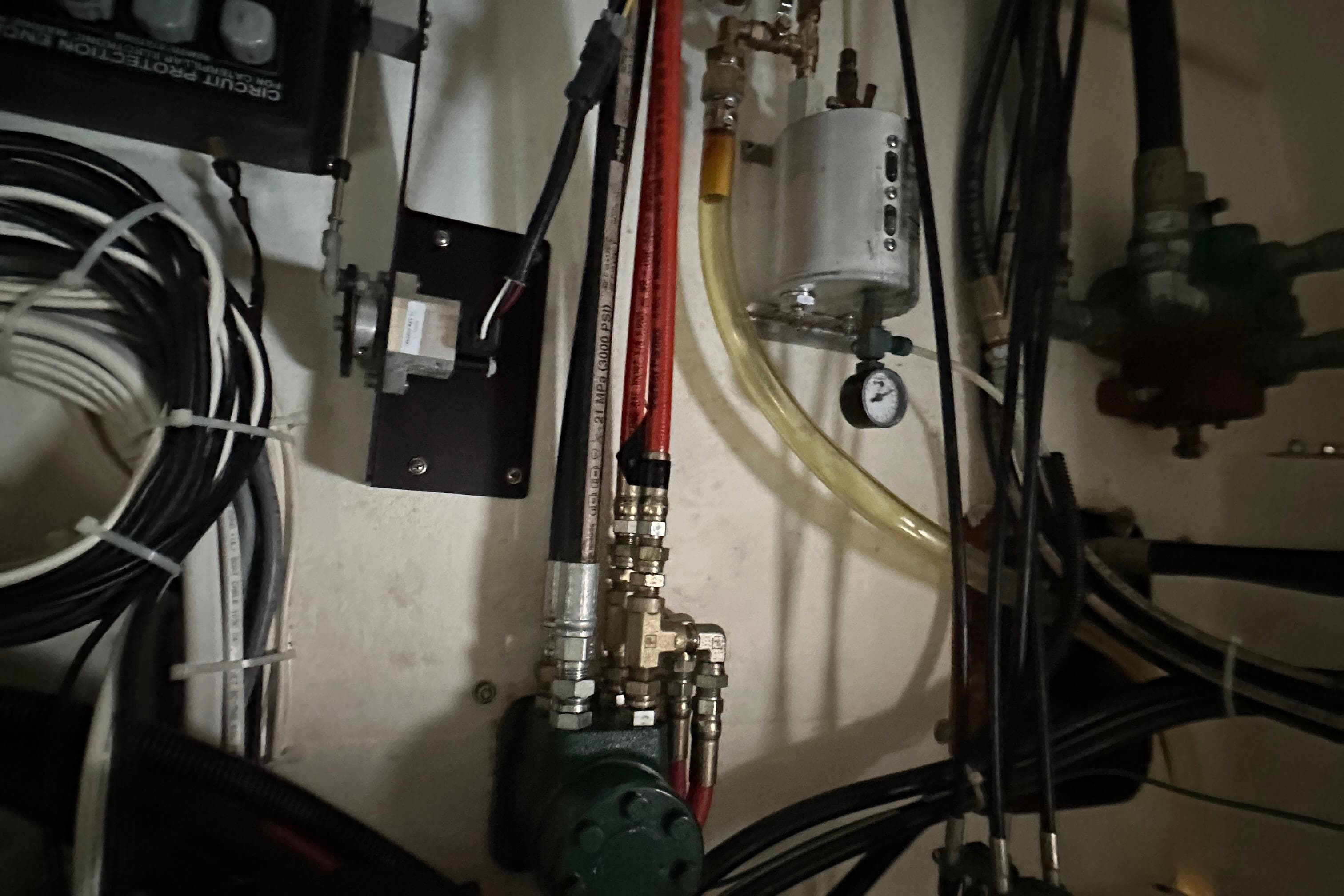 Engine room wiring and components of a 2003 BHM Sport Fish boat.