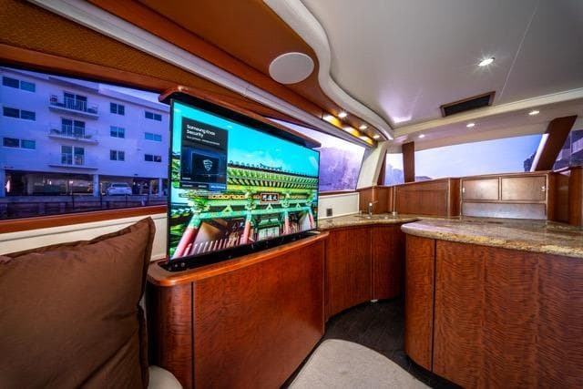 Luxurious interior of a 1997 Garlington Convertible yacht with modern amenities and elegant wood finishes.