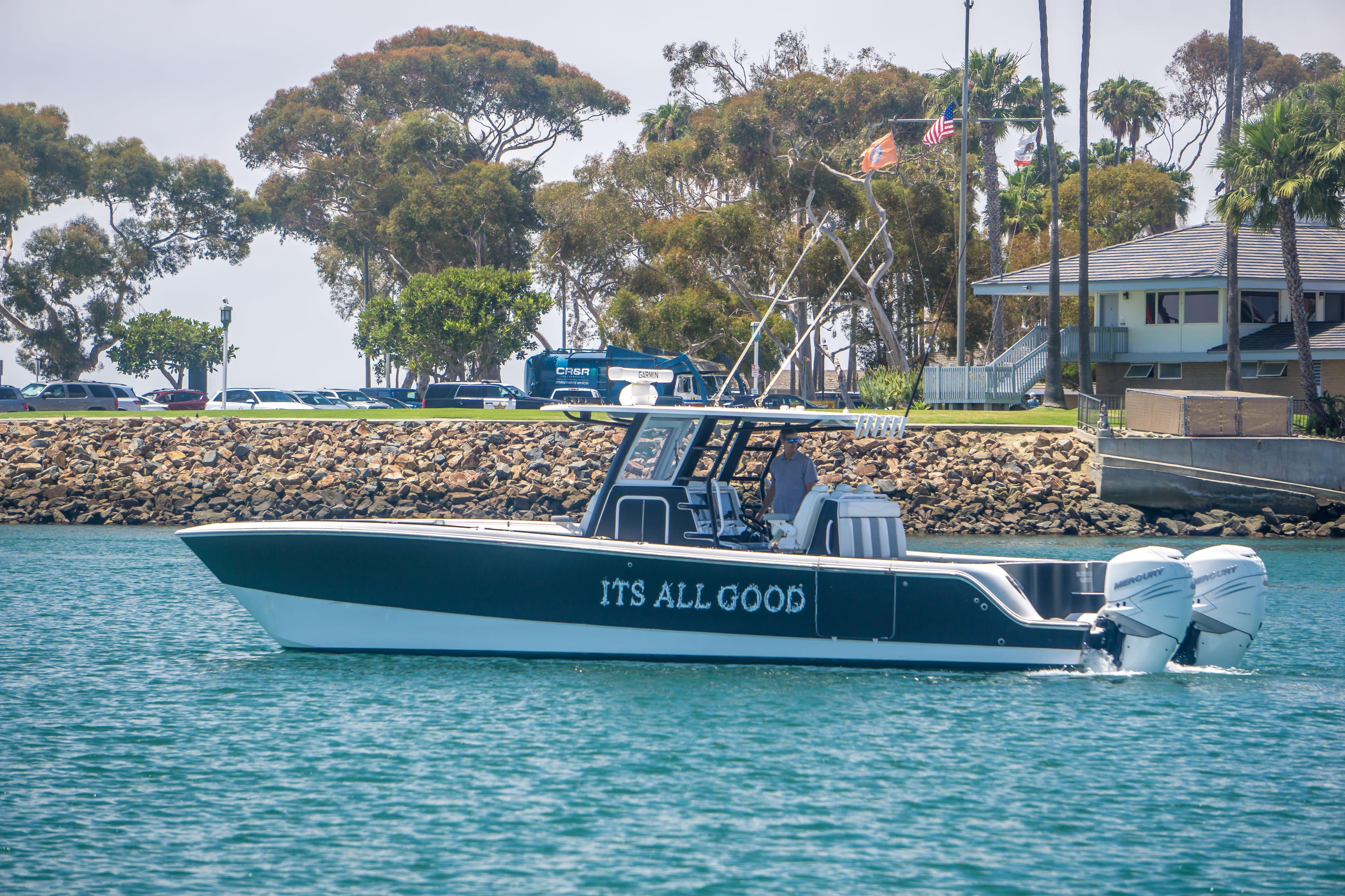Invincible 35 Catamaran 2021 on calm water near coastline.