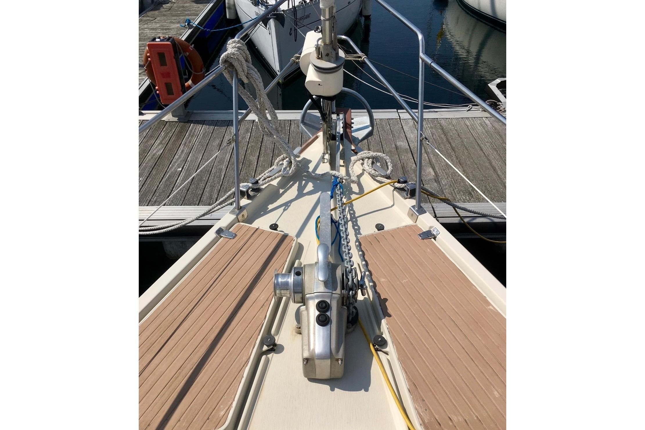 Bow of 1993 Amel Santorin Sloop with anchor chain and deck details.