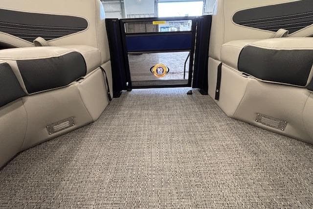Interior view of 2026 Barletta Corsa 23UC pontoon boat with plush seating and carpeted flooring.
