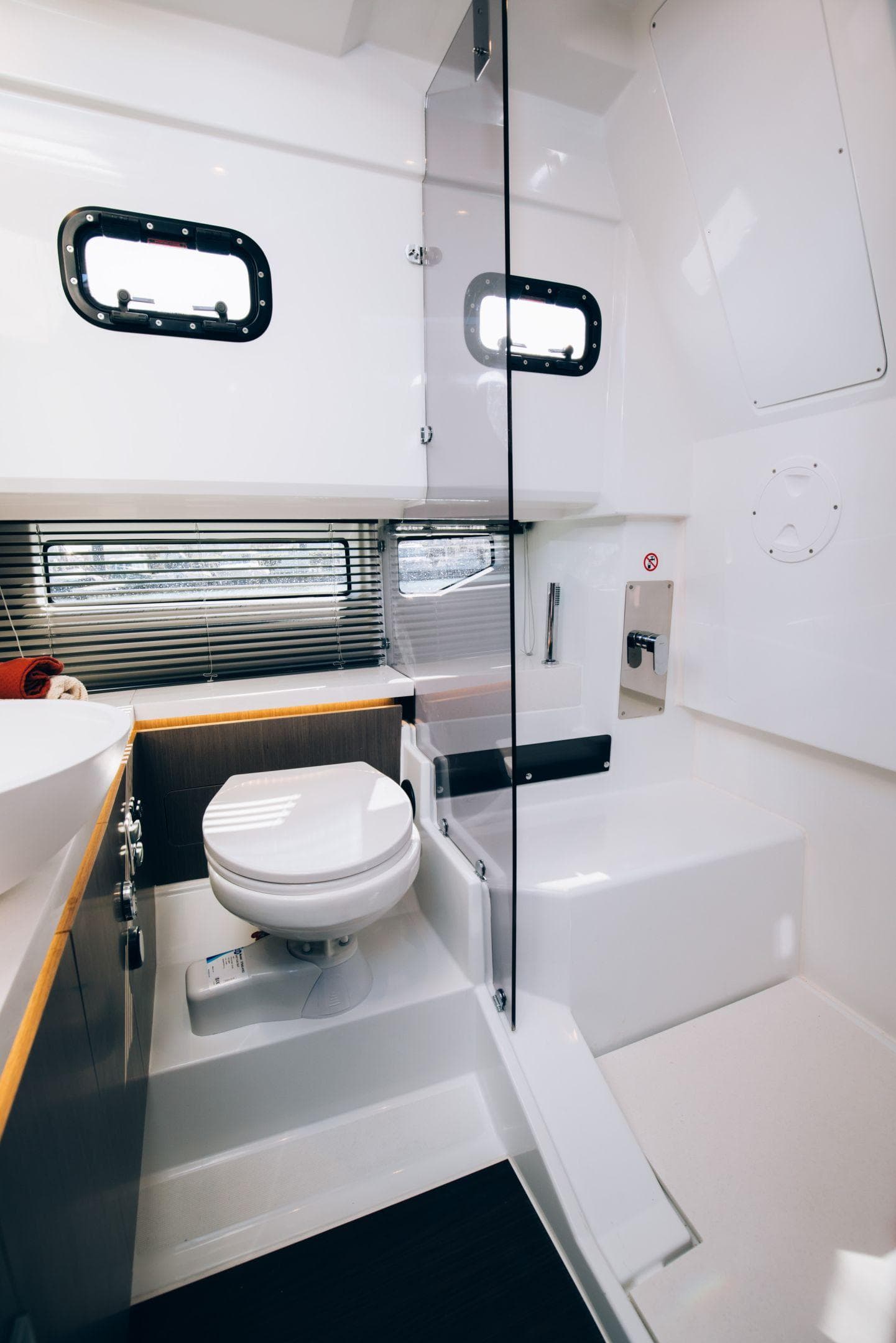 Modern bathroom in 2025 Wellcraft 38 Explorer yacht, featuring sleek design and compact layout.