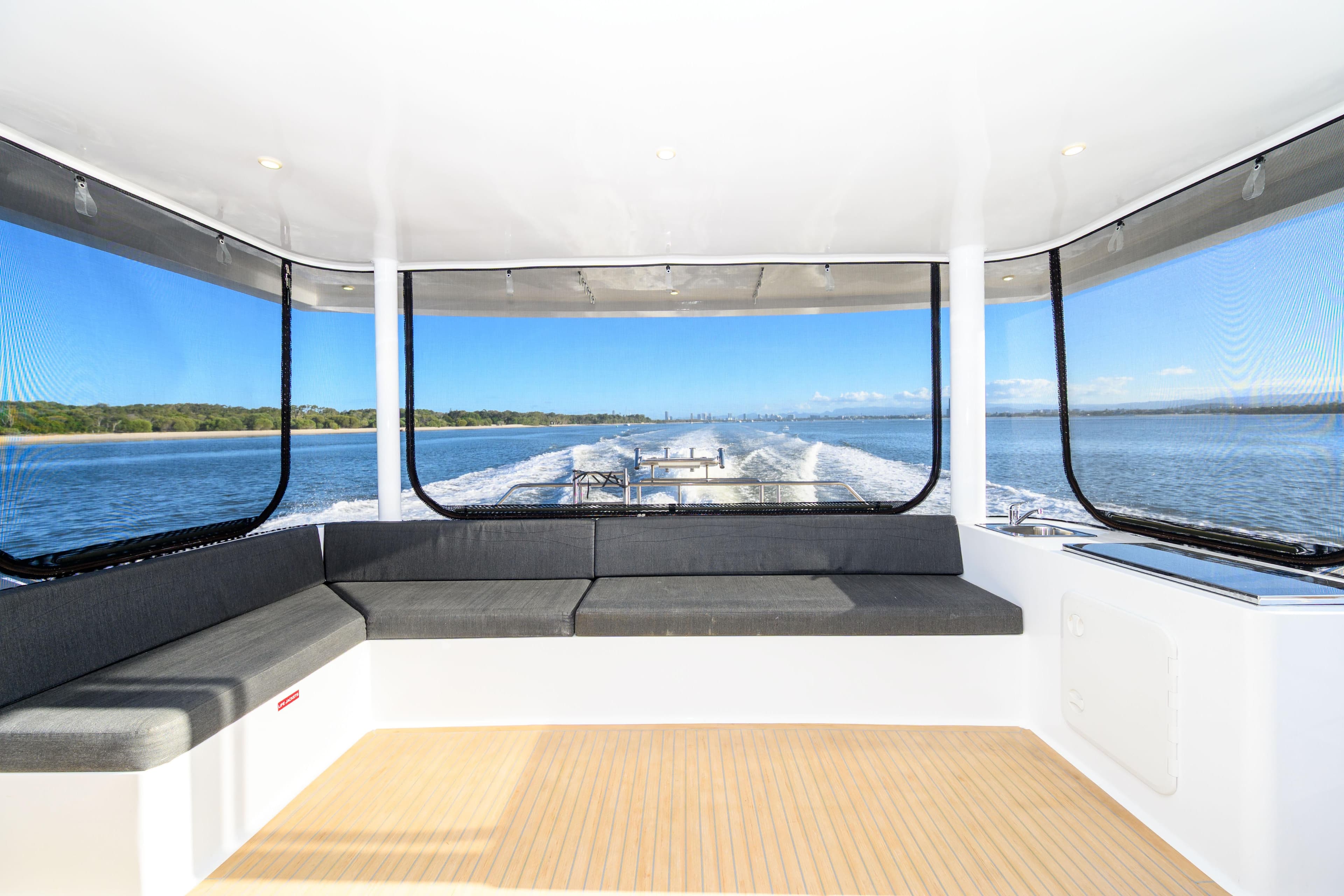 Luxurious Coral Coast 62 yacht interior, 2019 model, with panoramic water views.