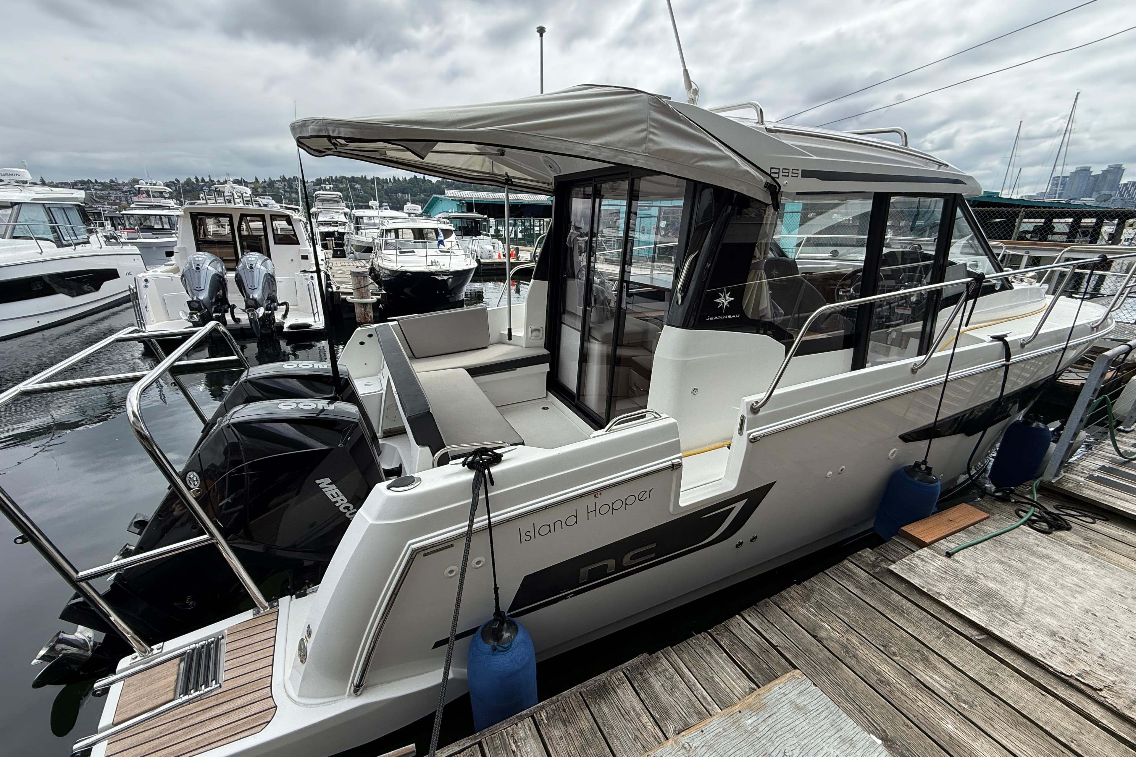2020 Jeanneau NC 895 boat docked at marina, featuring sleek design and modern amenities.