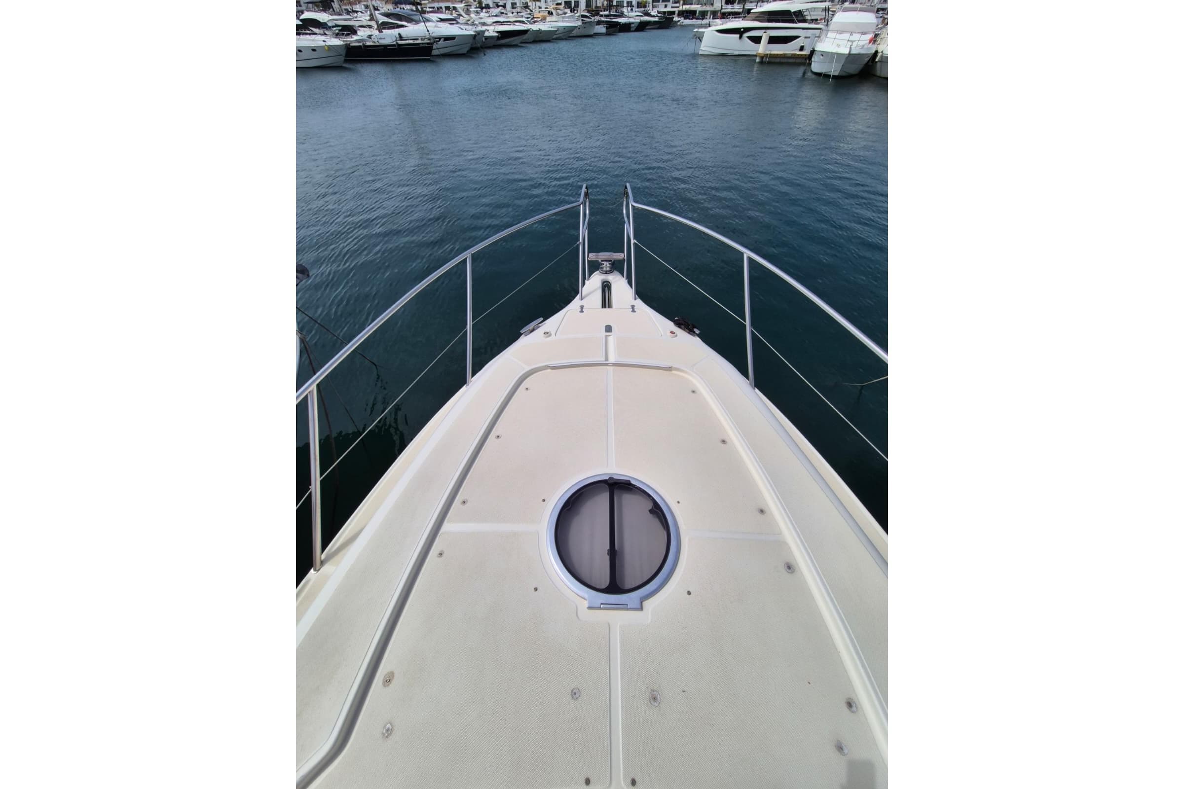 Bow view of 2008 Atlantis 345sc yacht docked in marina.