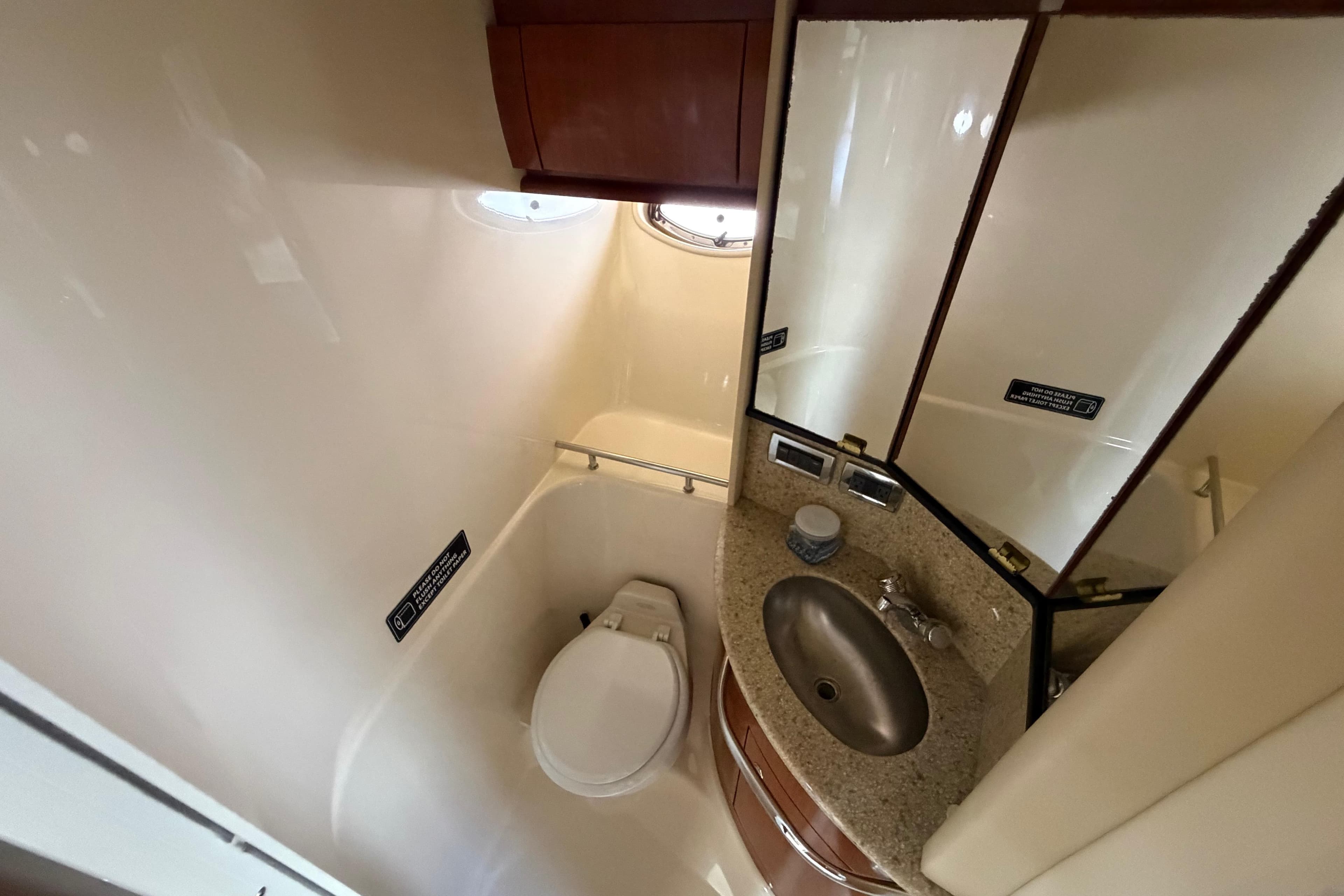 Bathroom interior of 2003 Sea Ray 420 Sundancer yacht with sink and toilet.