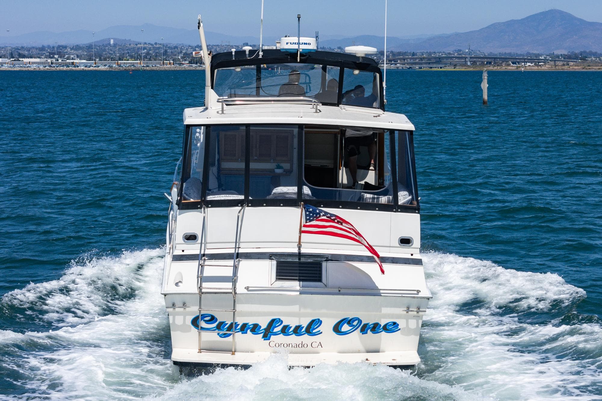 1982 Viking 44 Motor Yacht sailing with American flag in Coronado waters.