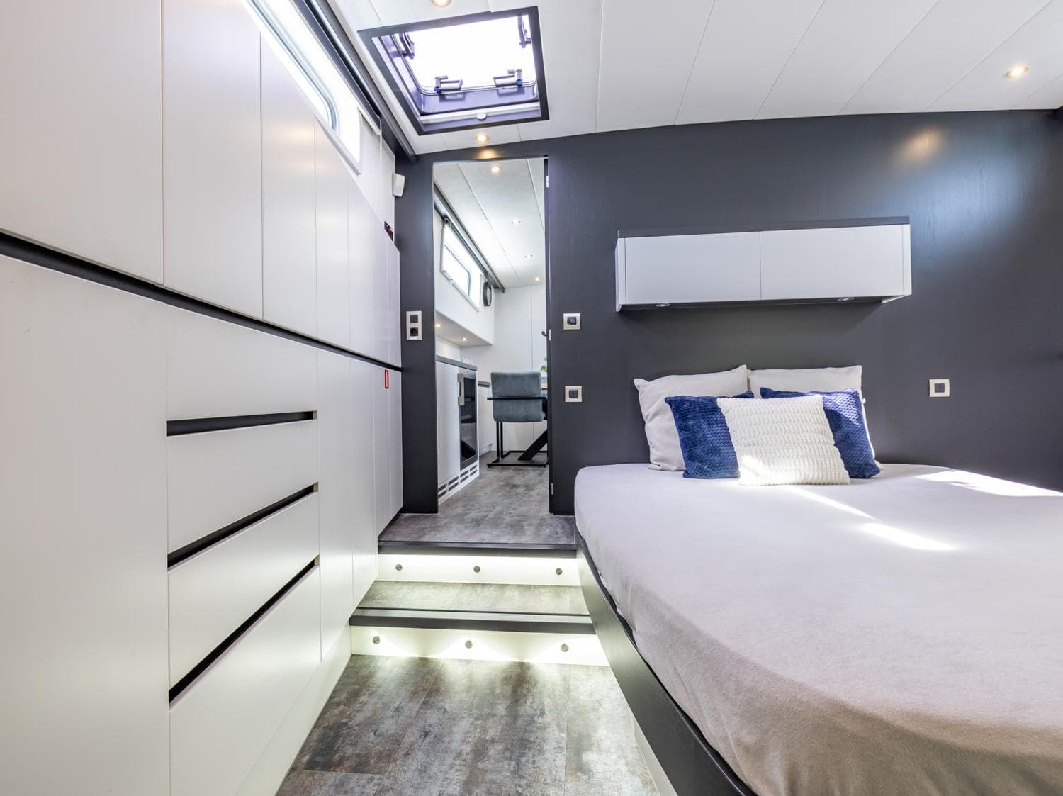 Luxurious bedroom interior in 2013 Bekebrede Luxemotor yacht, featuring modern design and skylight.