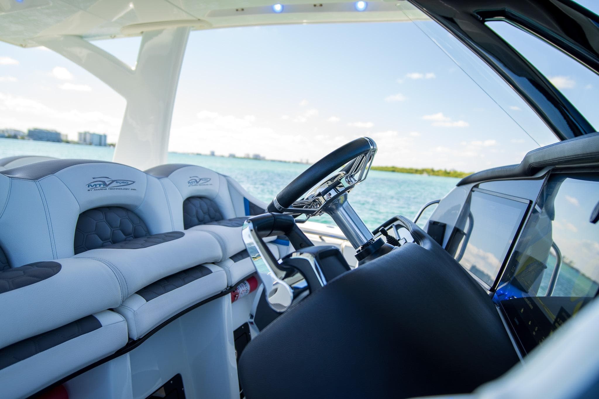 Luxury MTI 50v boat interior with modern steering and seating, 2023 model.