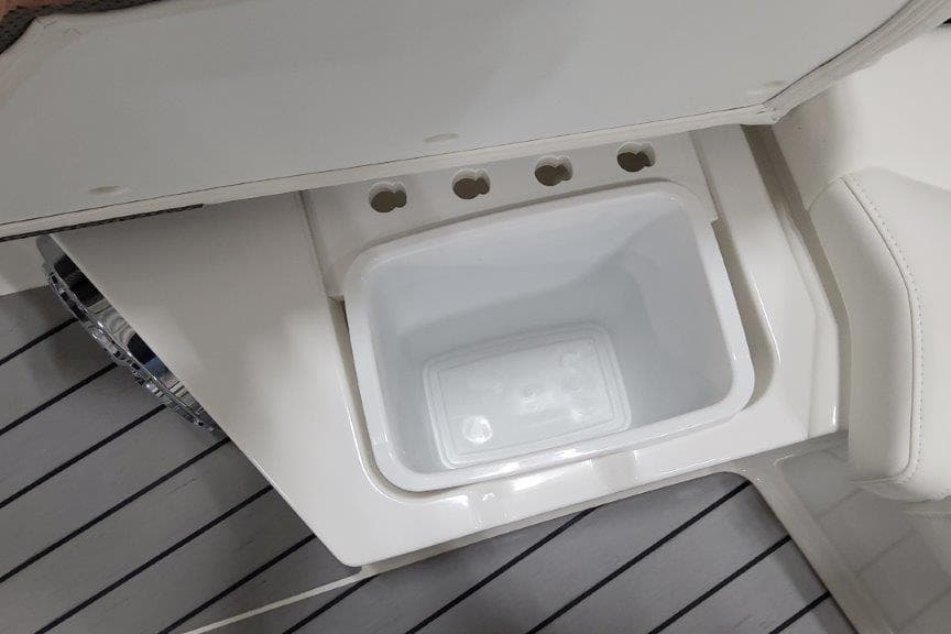 2022 Formula 380 Super Sport Crossover OB boat interior with built-in storage compartment.
