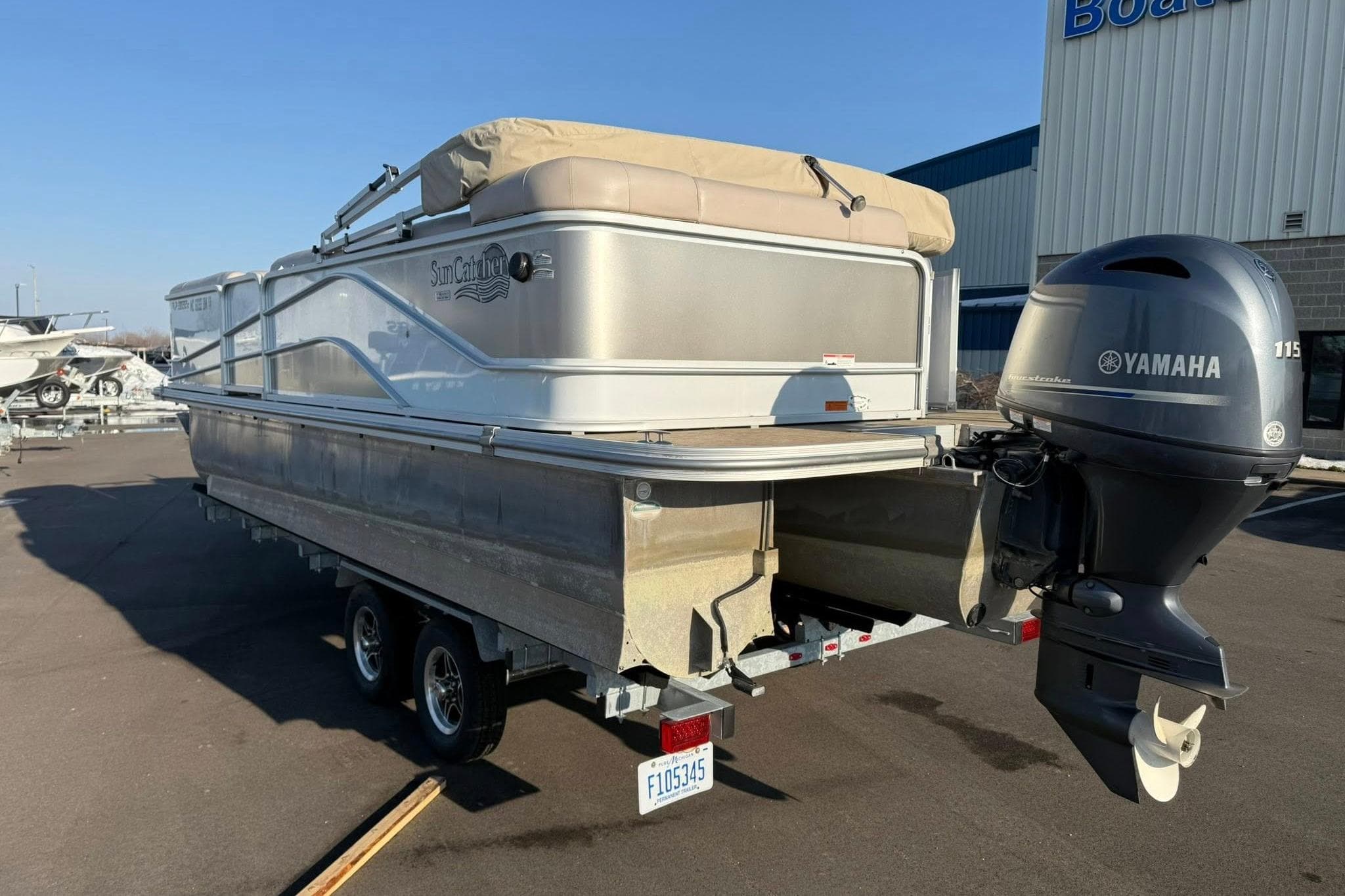 2019 SunCatcher V322 Cruise pontoon boat with Yamaha 115 engine on trailer.