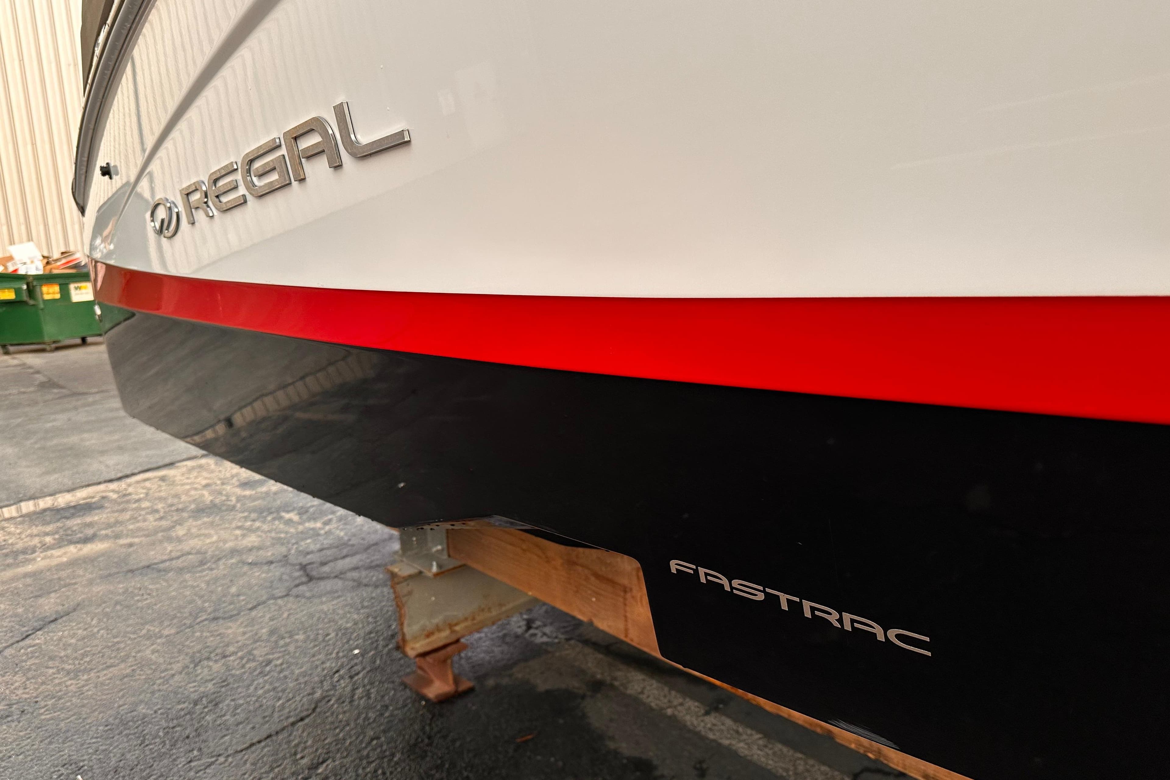 2020 Regal LS2 Surf boat with Fastrac hull design, docked on a stand.