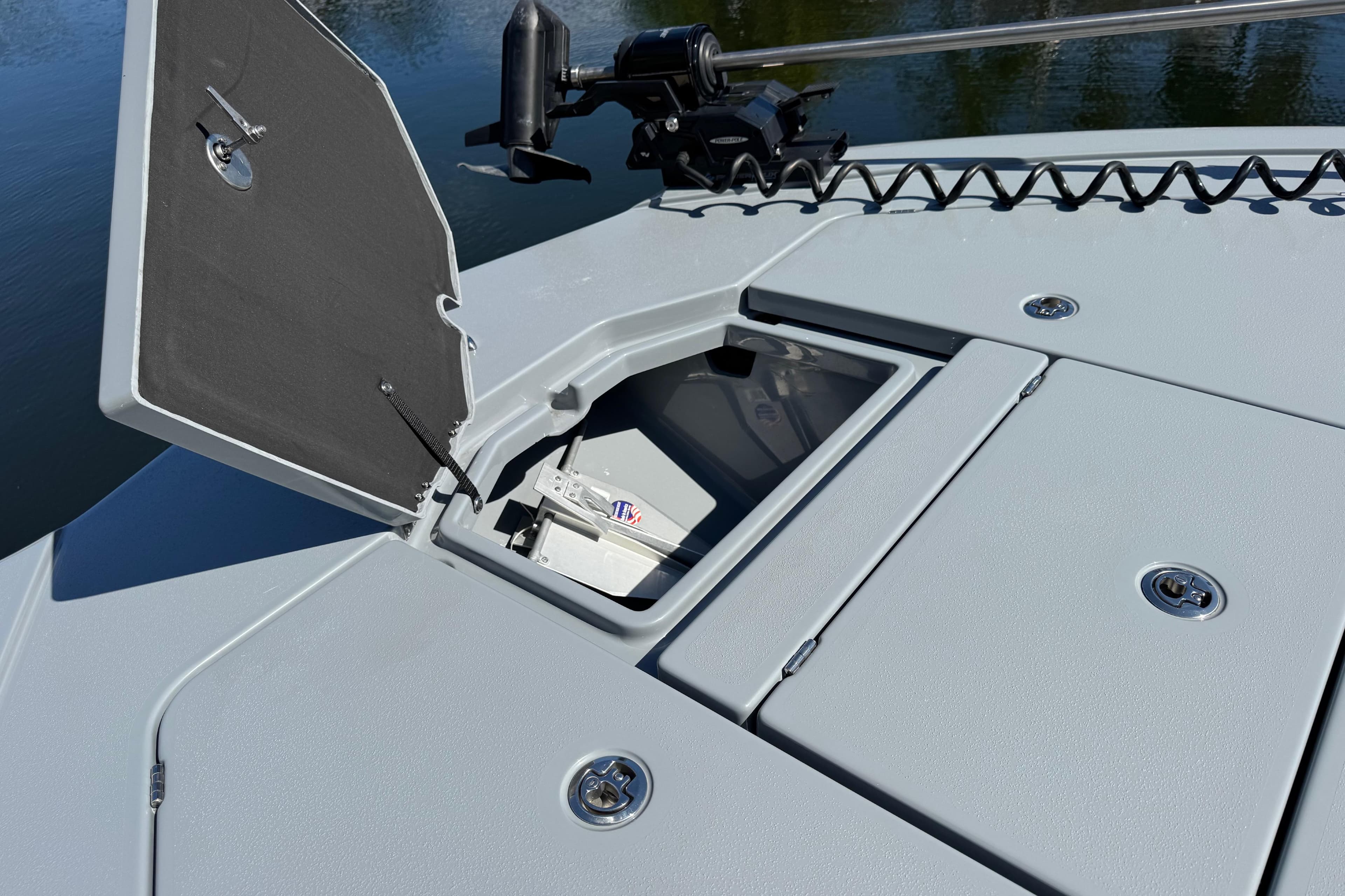 2026 Costa Custom Boats 264 HC deck with open storage compartment.