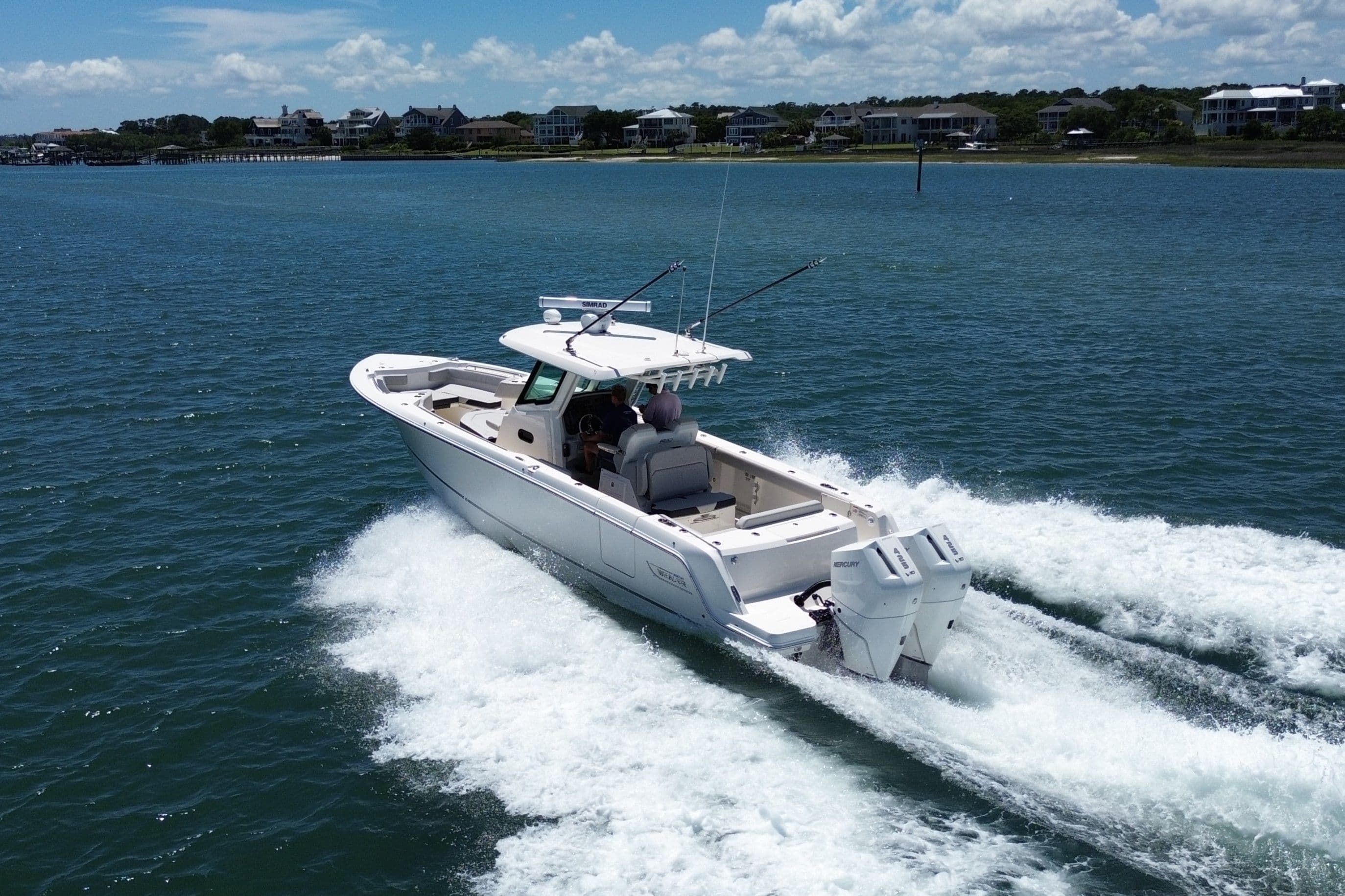 Boston Whaler 330 Outrage 2026 cruising on coastal waters.
