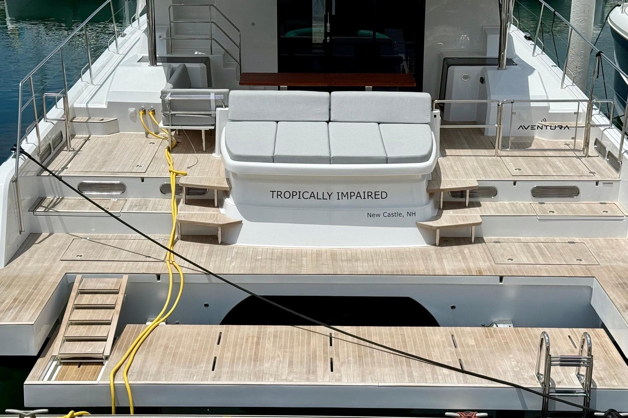 Luxury Aventura 56 yacht, 2026 model, docked with spacious deck and seating area.